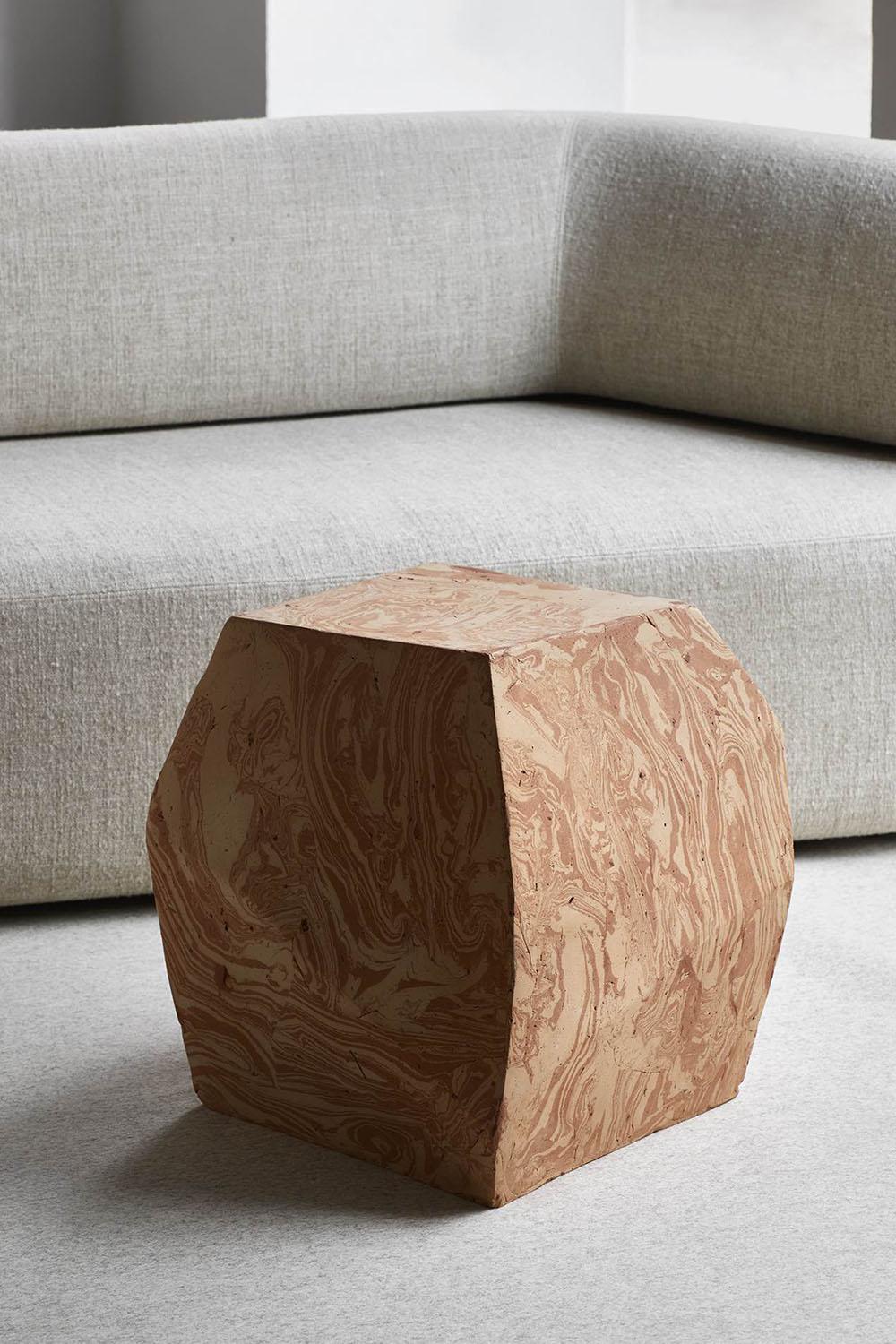 Terra is a side table with an unconventional design, by Luca Erba for the Collection Particuliere brand. 
Handmade in Italy with mixed clay.
Terra presents a raw geometric design, showing the solidity that the author has created. The meeting between
