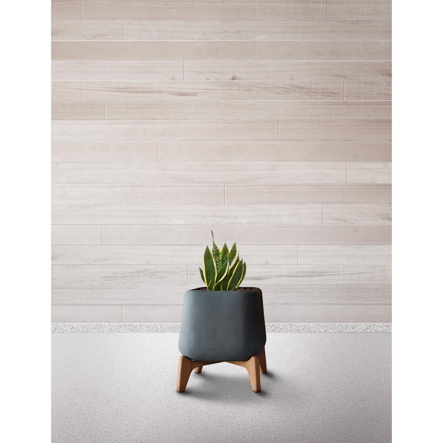 Terra Square XS Brown Planter With Oiled Wood Base by Indigenus
Designed by Laurie Wiid van Heerden
Dimensions: W 45,2 x H 52,5 cm.
Materials: Stone and wood.
Weight: 32 kg.

Different colors and sizes are available. Wood is available with a natural