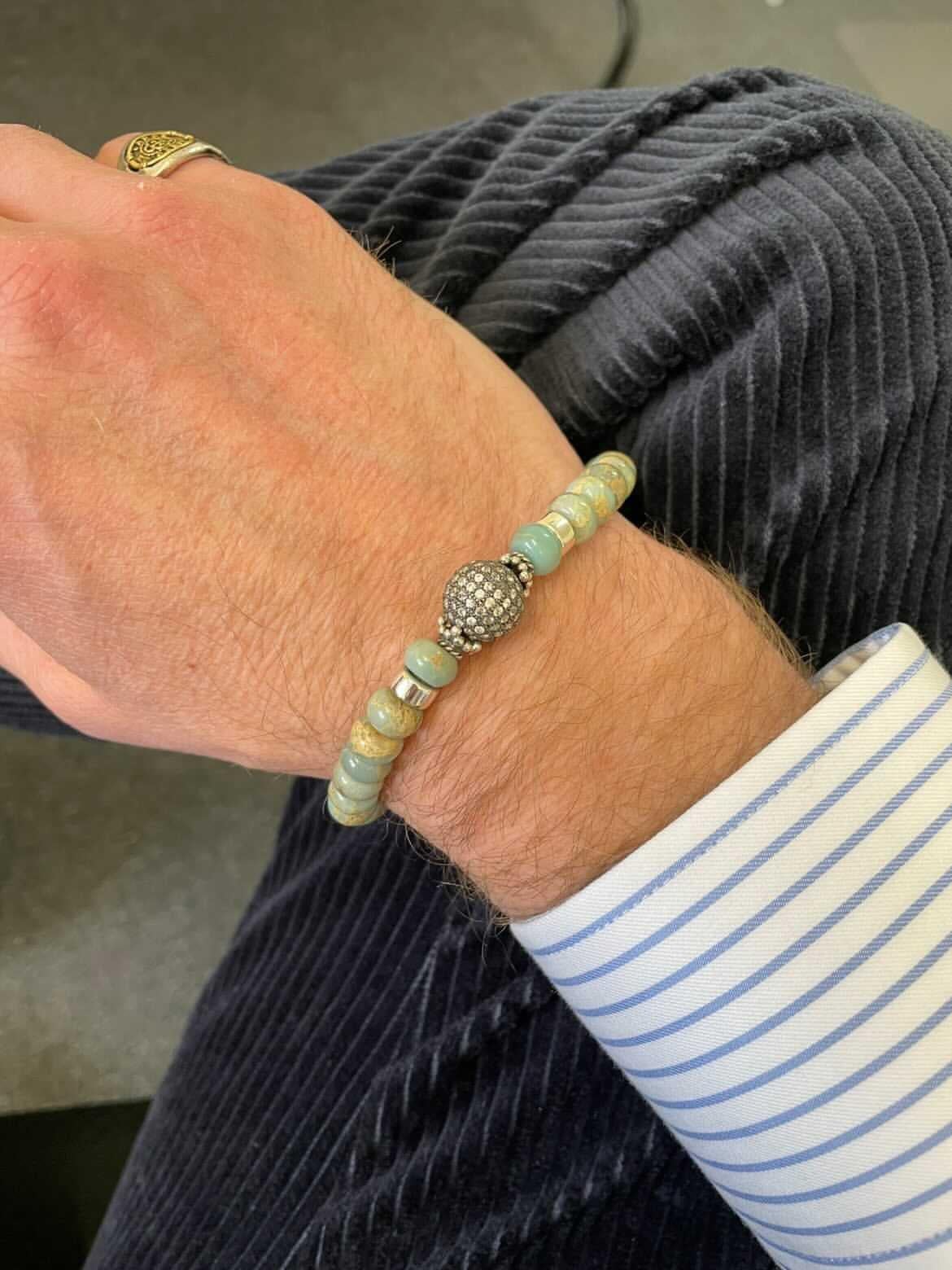 Behind the Jewelry
The Terrace Diamond bracelet is designed with AquaTerra Jasper and adorned with a pave diamond sphere which gives it an exceptional elegance and style.  The stones are rarely seen in men's bracelets.    
Designed and handmade in