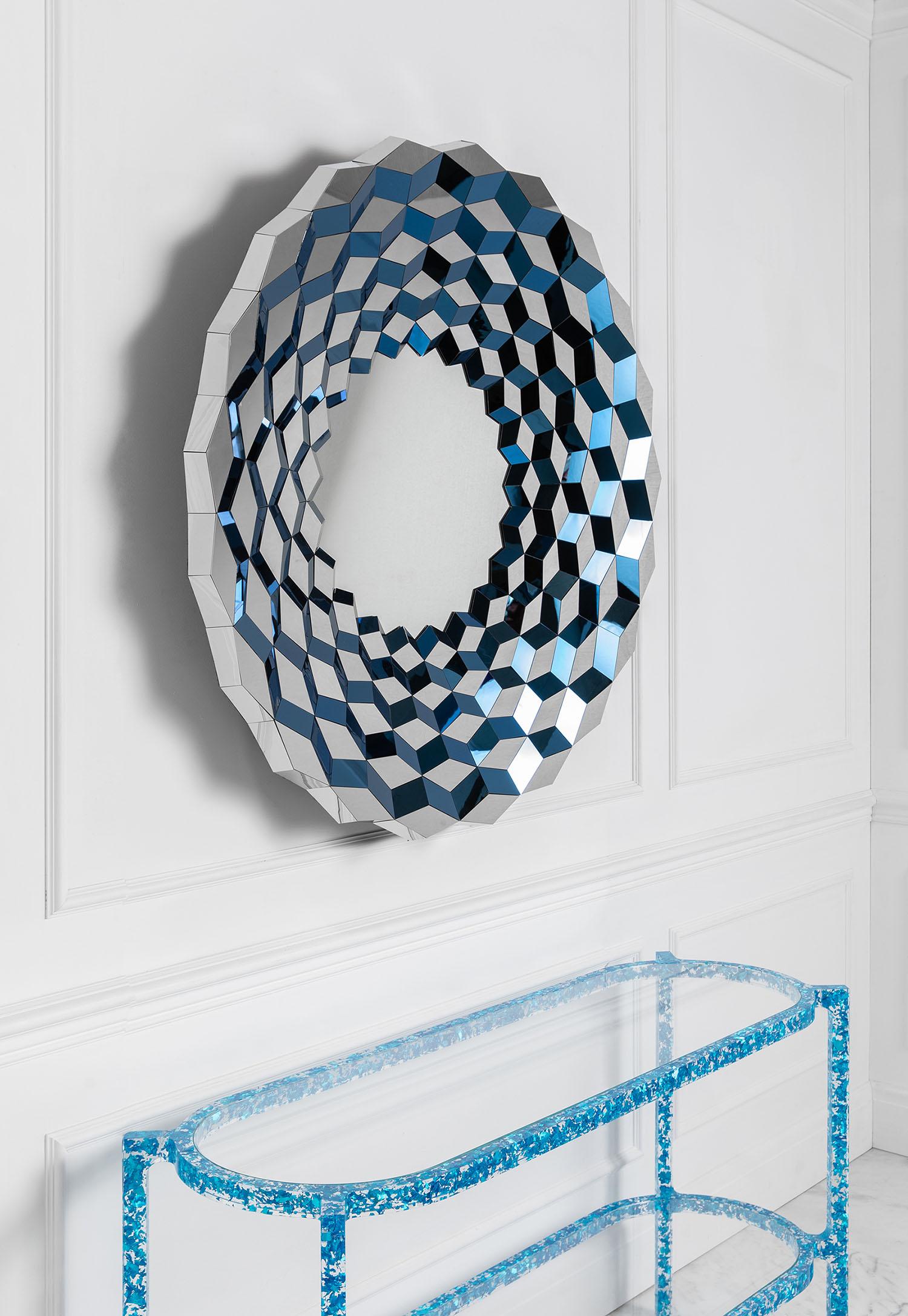 Of all things, a long haul flight to China helped inspire this facetted mirror.  When seen from the air, the still water that had been collected in hundreds of terraced paddy fields, cut deep into the valley sides, caught the early morning light