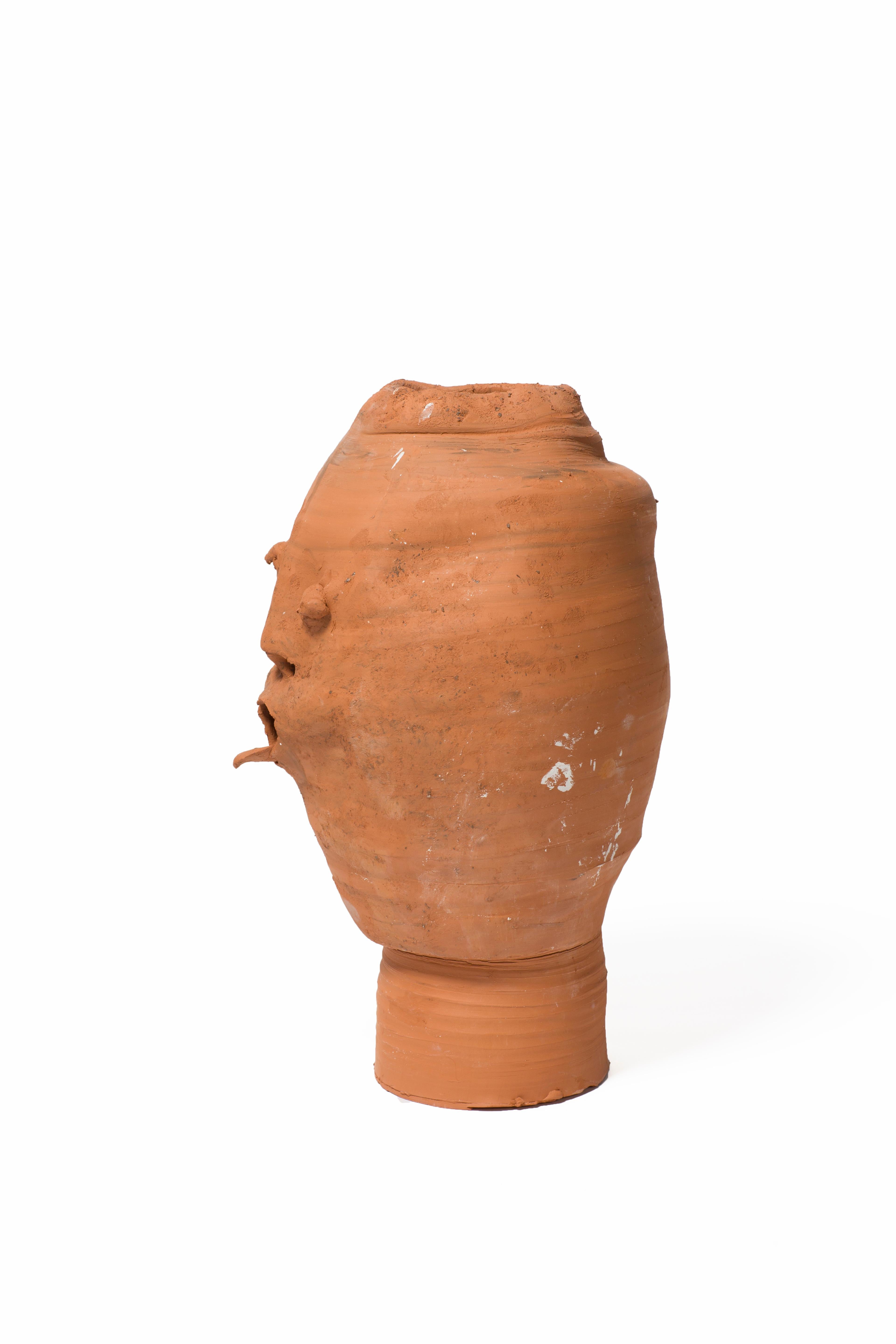 Terracotta head sculpture.
Can be used as a pot for plants and flowers.
Handmade and unique.