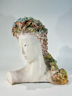 Terracota polychromed bust of woman with flowers signed