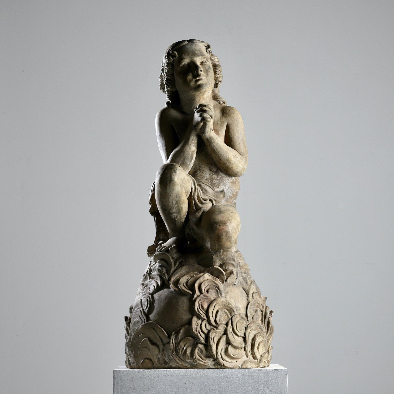 We present a 19th century terracotta statue.

France, Circa 1860.

” An atmospheric 19thc century terracotta figure of an angel at prayer, very well modelled, a pleasing, natural patination to the buff terracotta surface ”
 