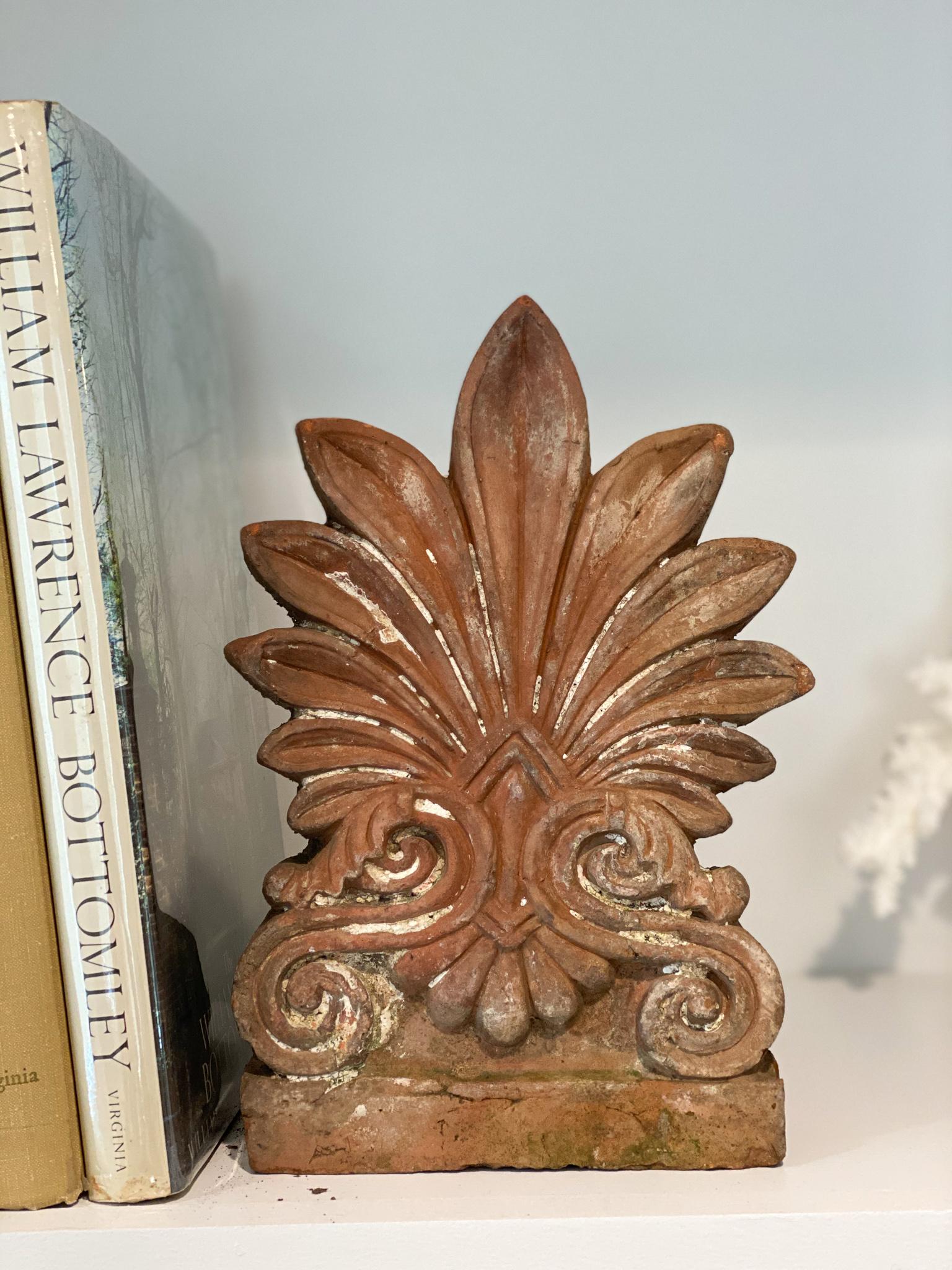 Terracotta anthemion roof tile, circa 1880. Anthemion was a design consisting of a number of radiating petals, developed by the ancient Greeks from the Egyptian and Asiatic form known as the lotus palmette.