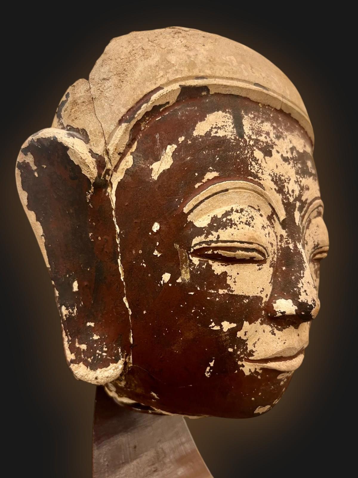 Stoneware Buddha head, Shan State Kingdom, Burma, 16th/18th century

Buddha head from a temple facing built entirely of mud bricks during the 16th/18th century. Maravijaya Buddha. Shan period, Burma. 

The finesse of the master sculptor's work is