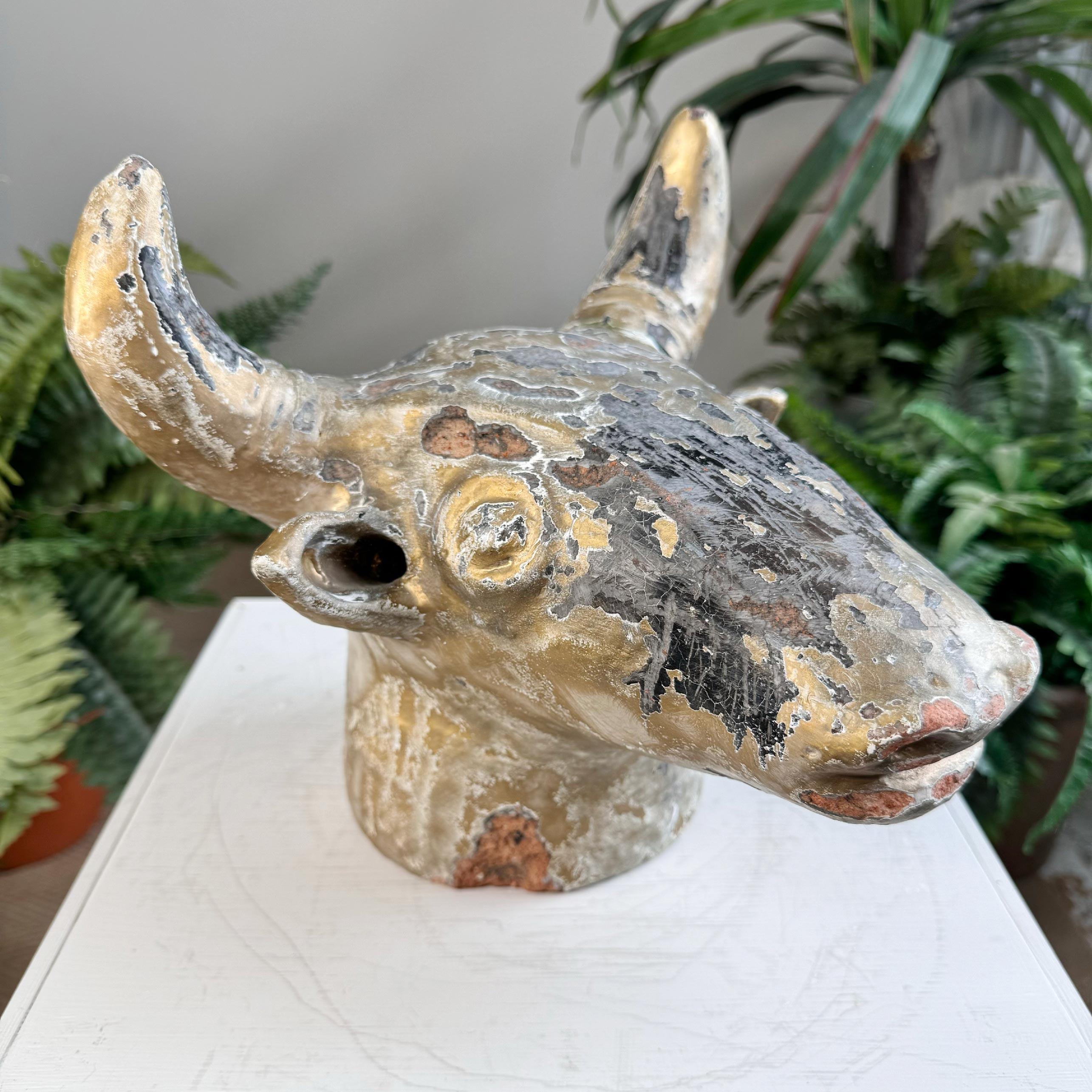 An unusual trade sign, formed as the head of a bull, in glazed and gilded terracotta, French, dating to the early 20th century.

 

Fantastic decorative item which could be displayed on a table or shelf. The head could also be wall mounted if a