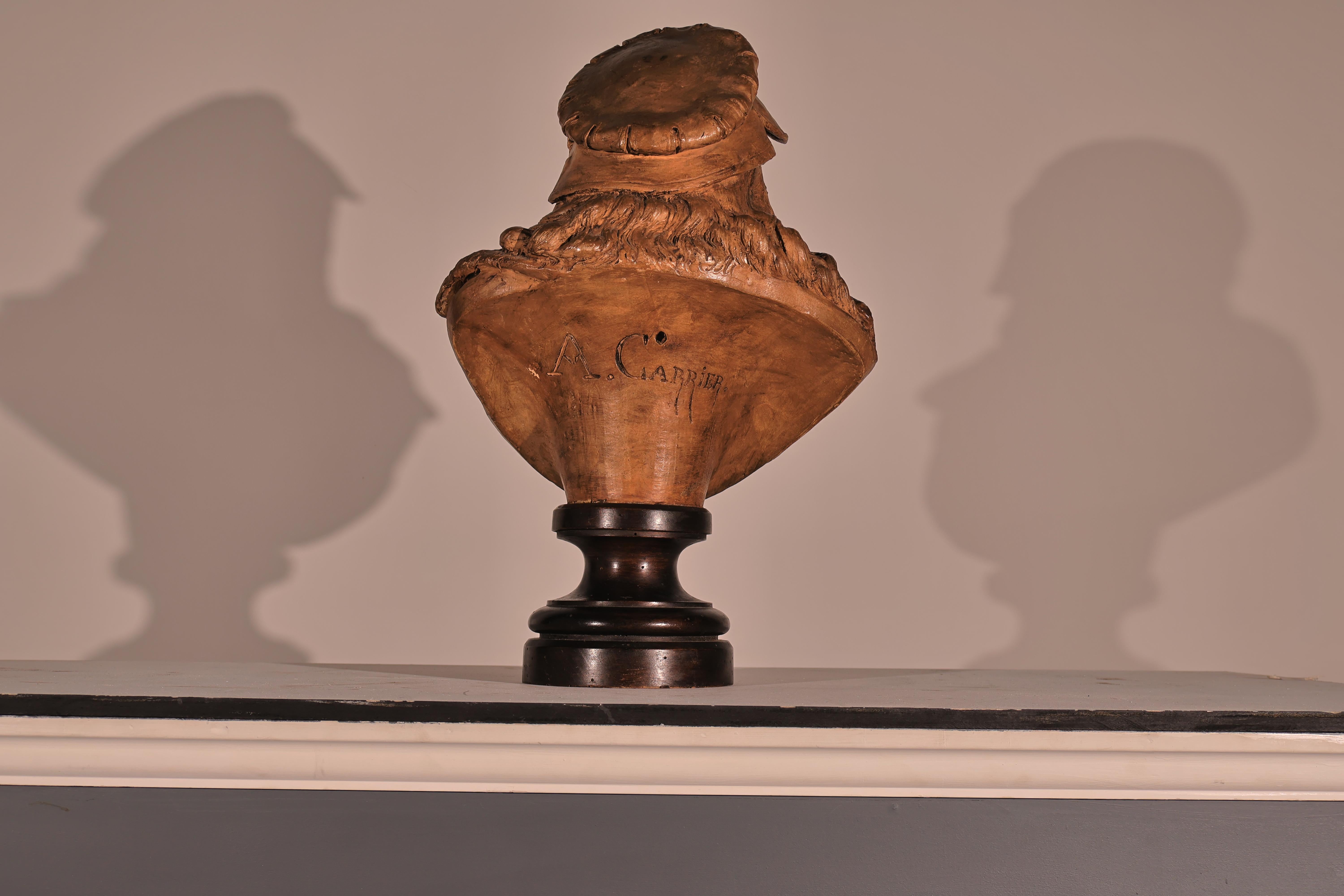 A Magnificent Terracotta Bust by Renowned Artist Albert Ernest Carrier Belleuse (French 1824-1887). Extraordinary Quality & Detail. Signed on the back A Carrier. France, circa 1860. Raised on turned wooden plinth
Dimensions: Height  20 3/4