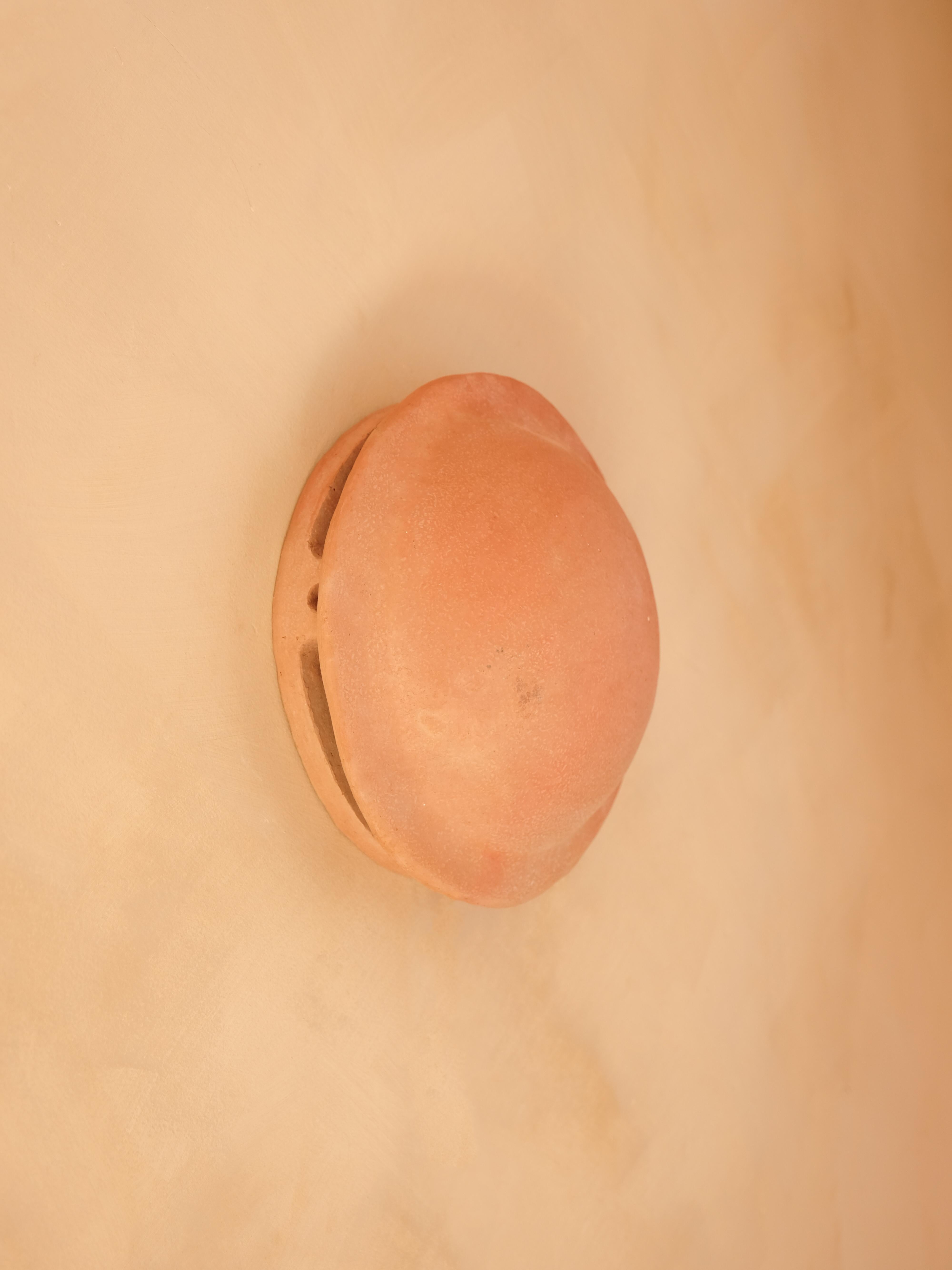 - Handbuilt terracotta ceramic wall light
- made of clay collected from the potter's surroundings.
- made in the Moroccan Rif mountains by the potter Houda.
- co-created by the potter Houda x memòri team
- small scale-production
- an extra fixing is