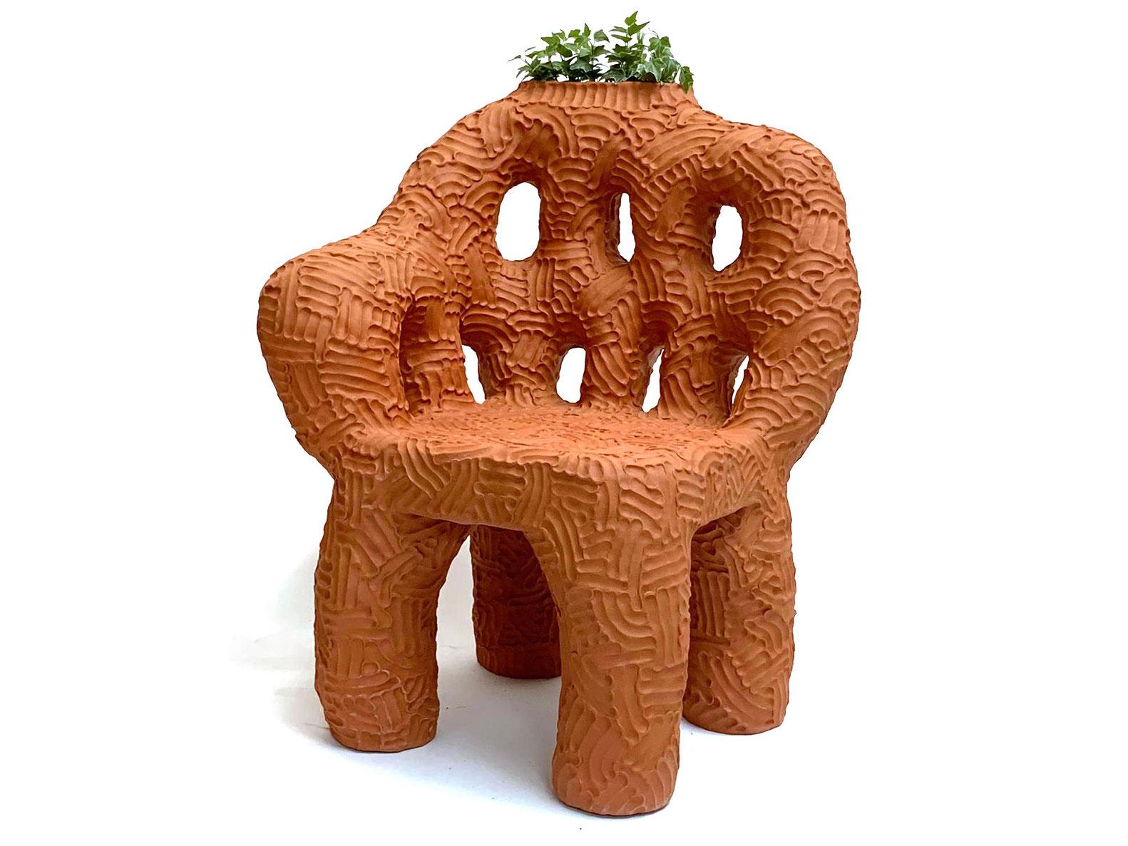 Terracotta indoor/outdoor planter chair, handmade by New York and Medellín-based artist Chris Wolston. One currently available, additional can be made to order with a lead time of 12-14 weeks.