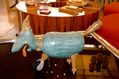 Terracotta Comic Caricature of a Dog on Wheels