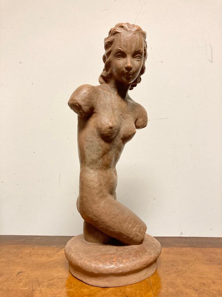 A beautiful glazed terracotta nude, shown in a contrapposto pose. She is both modern, with her stylish hair and classical, harking back to ancient Roman sculpture. Stamped Goldscheider, Wein marks. 
Nice scale at 17.25 inches high 7.25 wide 6.5