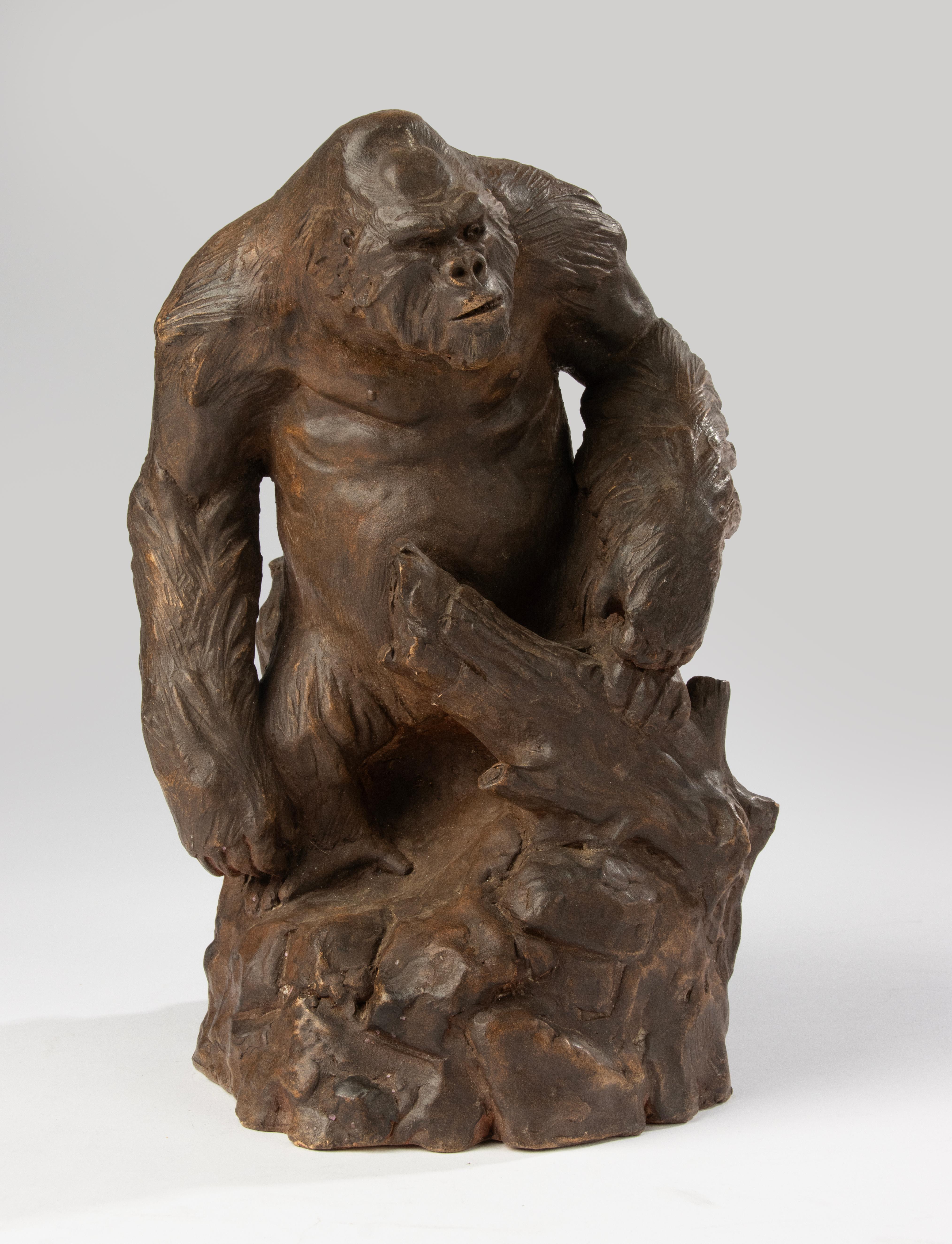 A powerful and expressive modern animalier sculpture by Belgian ceramist Chen M, featuring a gorilla posed with striking intensity and anatomical realism. Hand-sculpted in terracotta, the surface captures every muscle and motion, lending the piece a