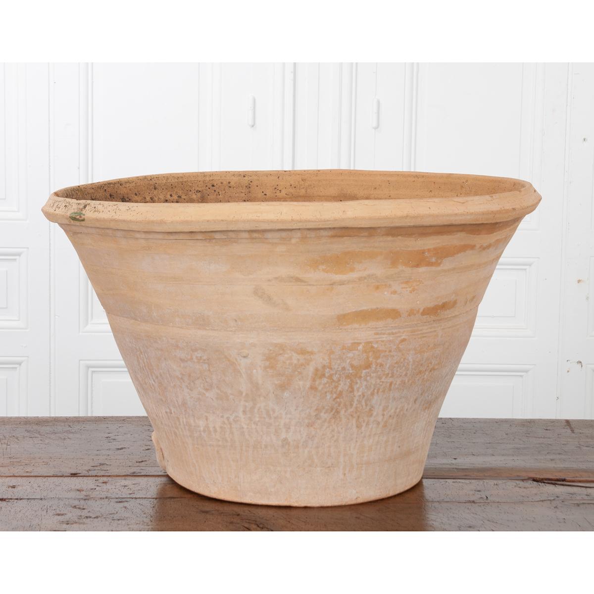 This unglazed terracotta bowl is beautifully primitive and massive. The natural color of the terracotta is still bright, despite the years of use it’s endured. Please view the detailed images to see more.
   
