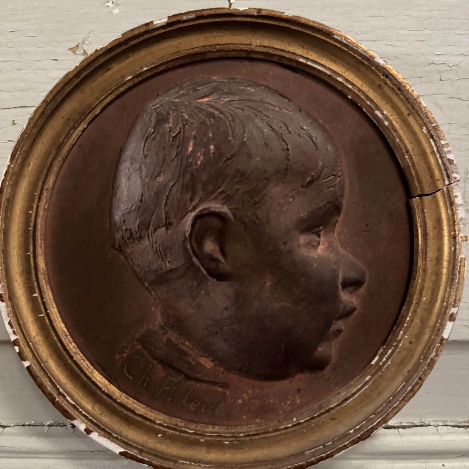 20ième siècle Terracotta medallion by Charles Filleul – Profile of a young boy, 20th century. en vente