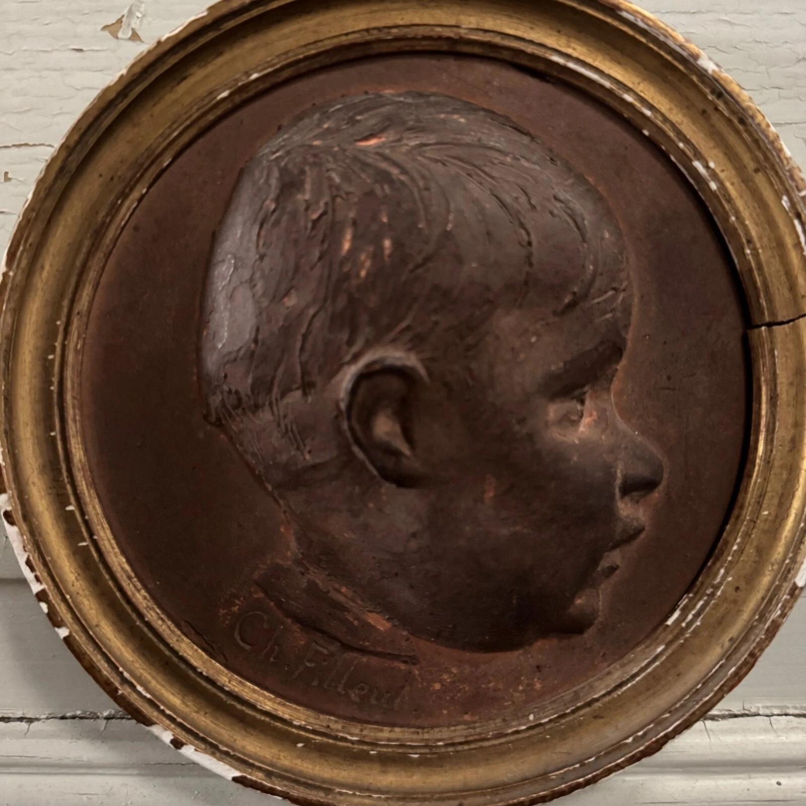Terre cuite Terracotta medallion by Charles Filleul – Profile of a young boy, 20th century. en vente