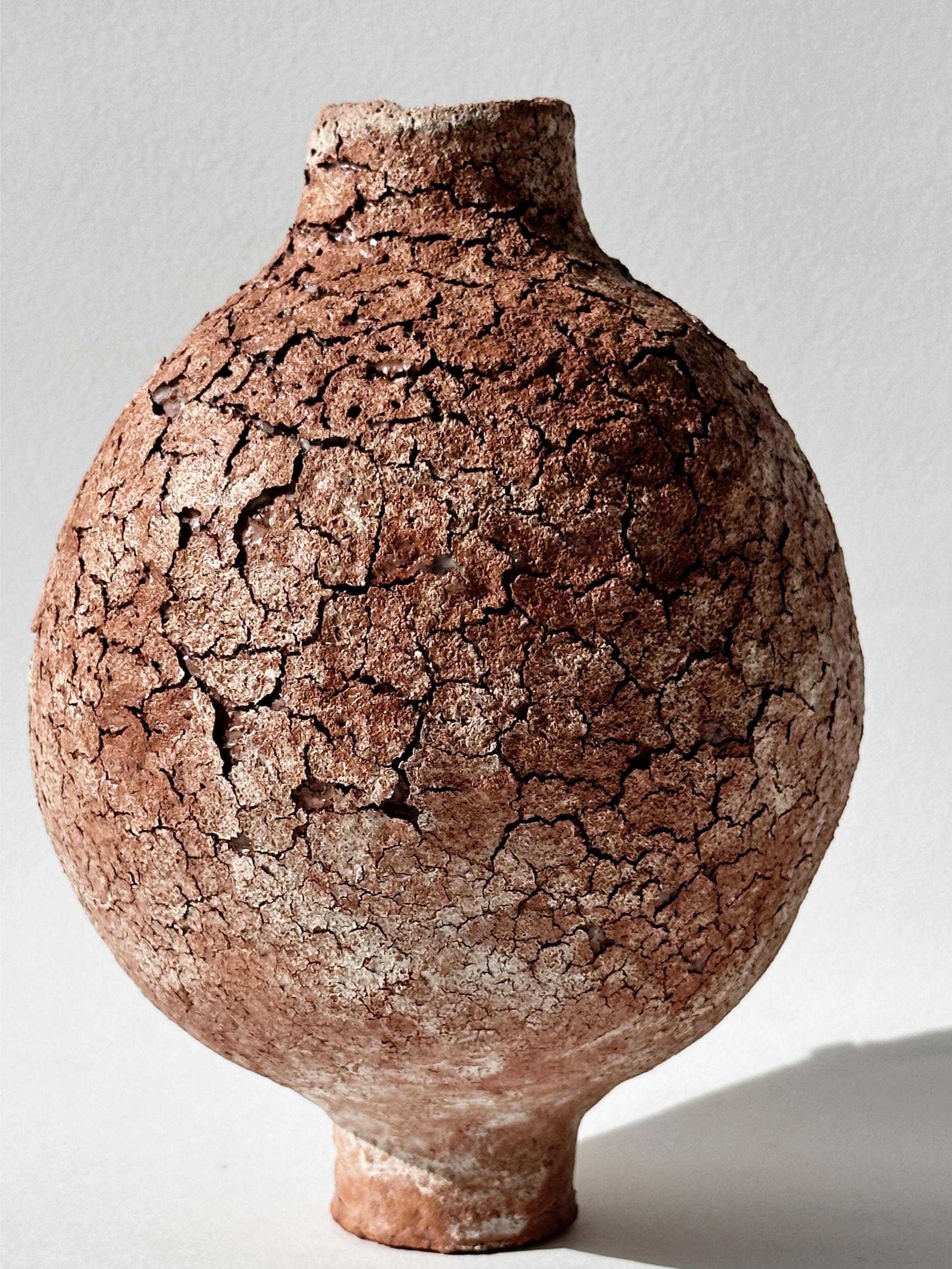 Terracotta Moon Jar No 10 by Elena Vasilantonaki
Unique
Dimensions: ⌀ 14 x H 18.5 cm (Dimensions may vary)
Materials: Local Terracotta Clay from the Island of
Crete

Growing up in Greece I was surrounded by pottery forms that have changed little