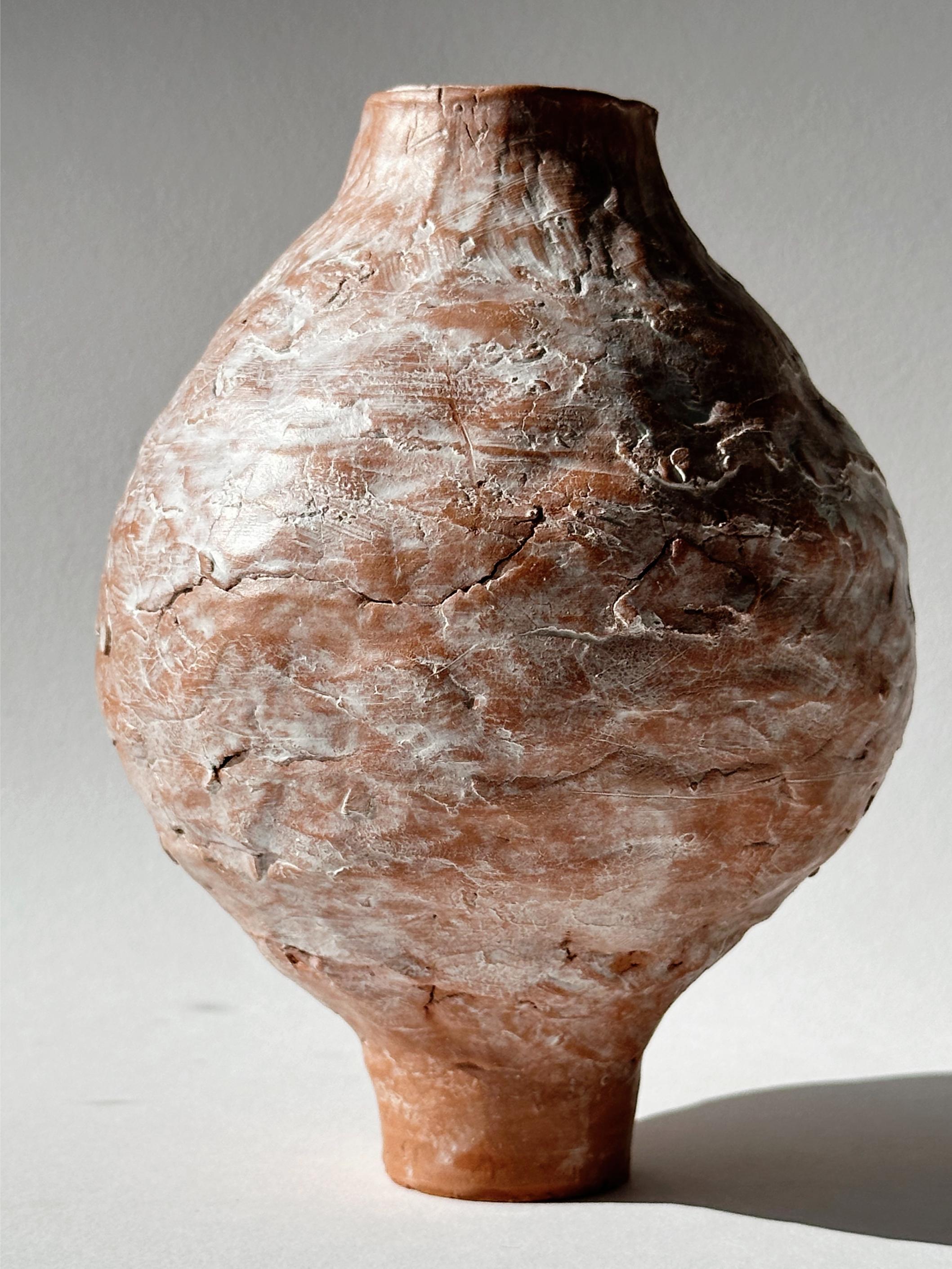 Terracotta Moon Jar No 3 by Elena Vasilantonaki
Unique
Dimensions: ⌀ 13 x H 17 cm (Dimensions may vary)
Materials: Local Terracotta Clay from the Island of
Crete

Growing up in Greece I was surrounded by pottery forms that have changed little since