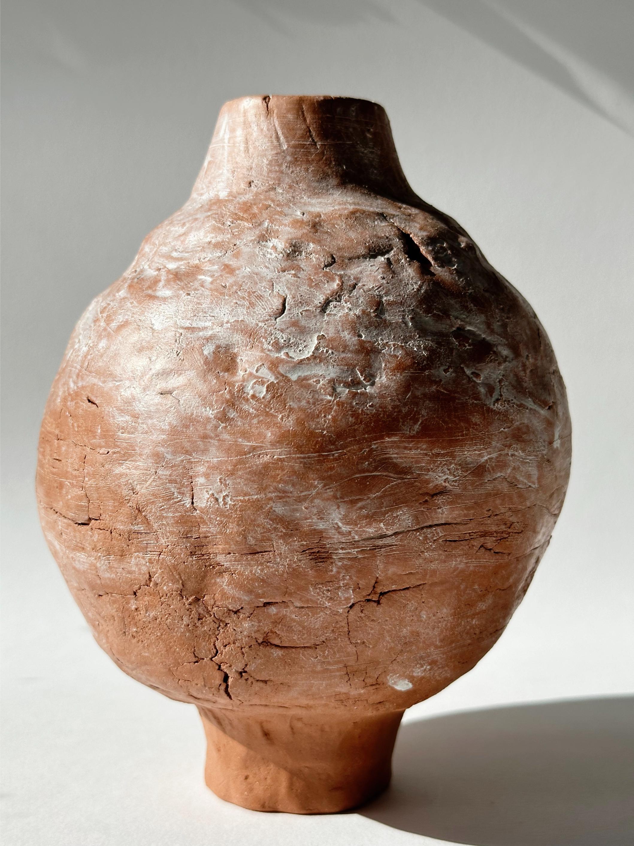 Terracotta Moon Jar No 4 by Elena Vasilantonaki
Unique
Dimensions: ⌀ 14.5 x H 18.5 cm (Dimensions may vary)
Materials: Local Terracotta Clay from the Island of
Crete

Growing up in Greece I was surrounded by pottery forms that have changed little