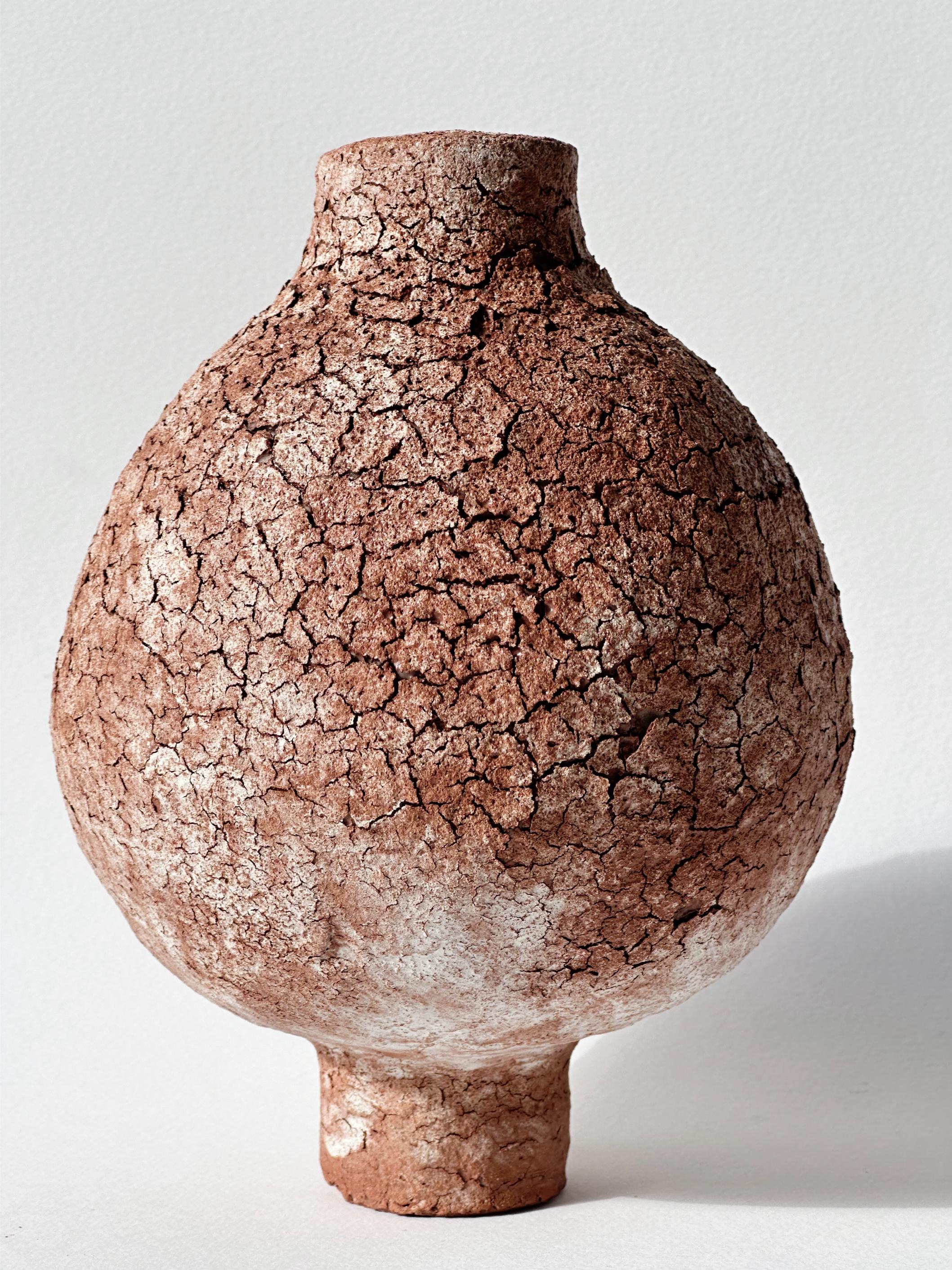 Terracotta Moon Jar No 9 by Elena Vasilantonaki
Unique
Dimensions: ⌀ 14 x H 18 cm (Dimensions may vary)
Materials: Local Terracotta Clay from the Island of
Crete

Growing up in Greece I was surrounded by pottery forms that have changed little since