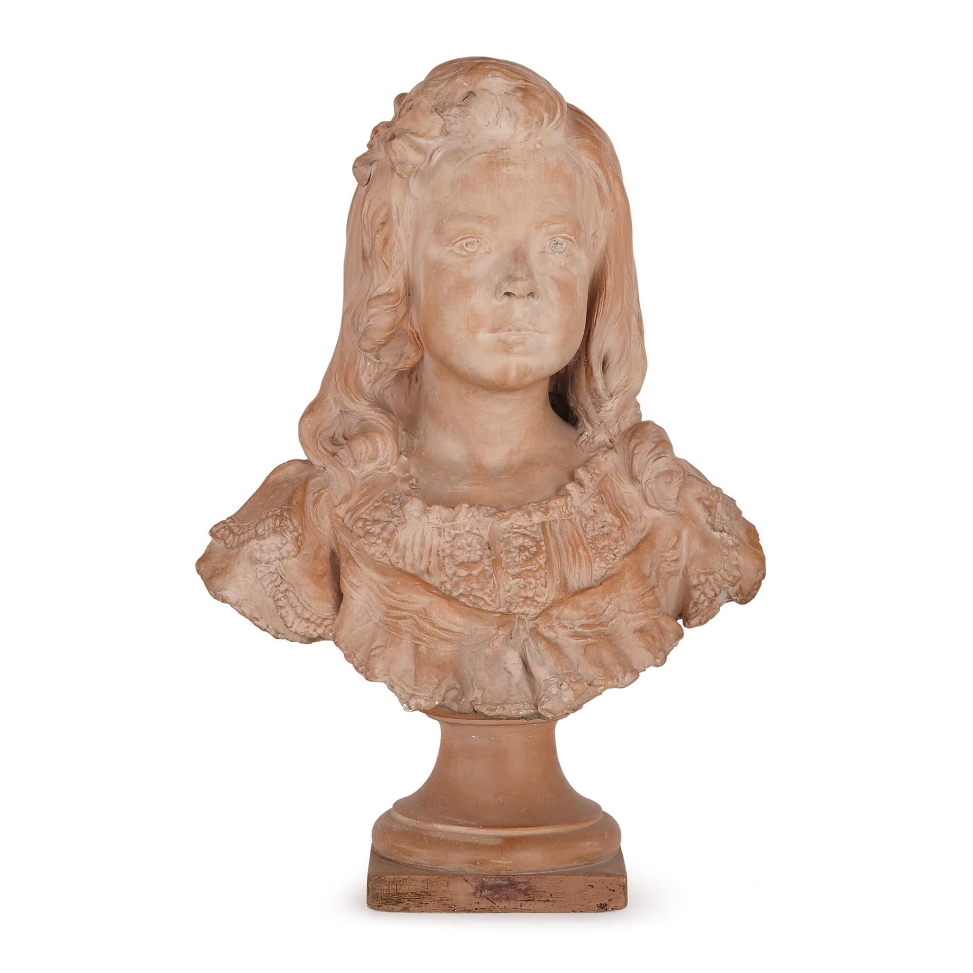 Terracotta portrait bust of a girl by Henri Weigele
French, late 19th Century
Height 57cm, width 40cm, depth 23cm

This charming portrait bust of a young girl is crafted from terracotta. The young girl is rendered naturalistically, with a poised and