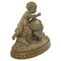 Terracotta Putti Statue Resting on Conforming Raised oval Base Signed " R. Rod "