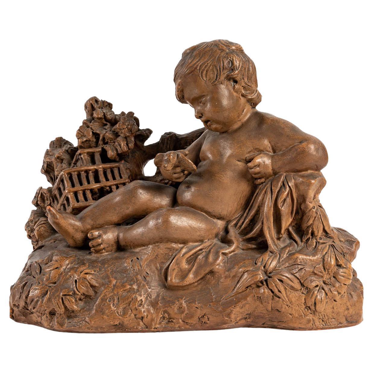Terracotta representing a child and a bird in the hand, signed, early 20th century, Louis XV style.
Measures: H: 24 cm, W: 32 cm, D: 15 cm.