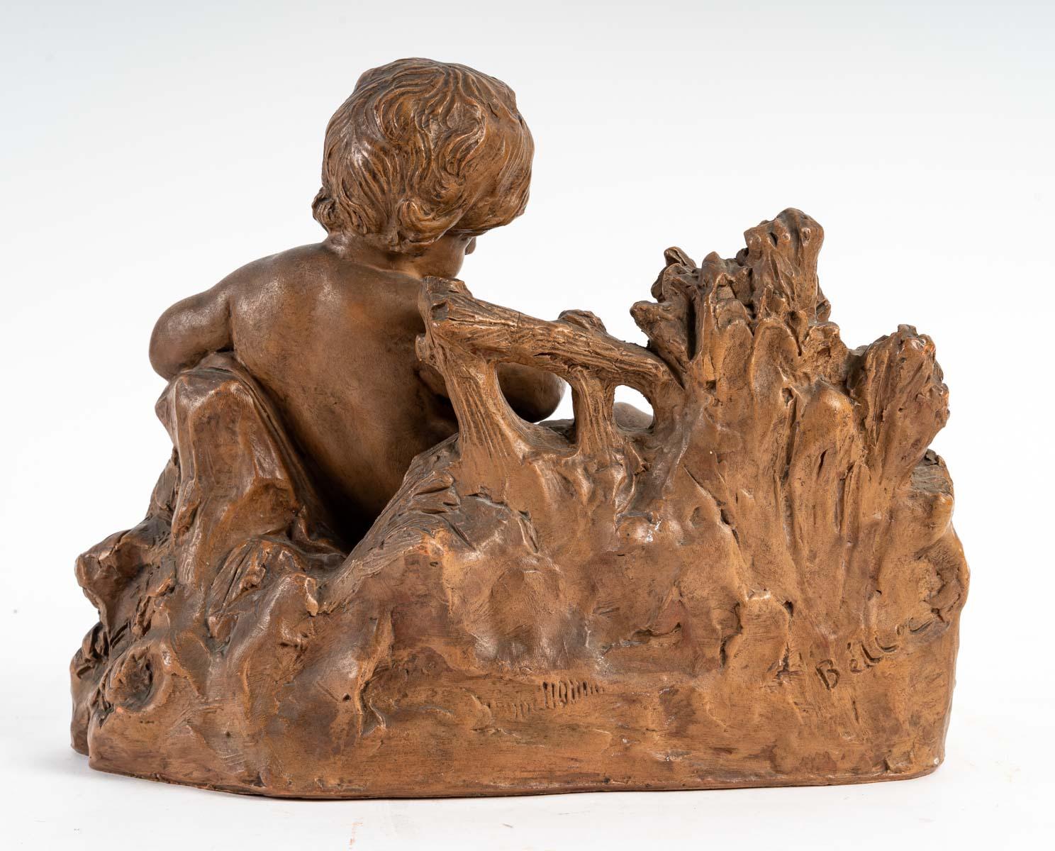 20th Century Terracotta Representing a Child and a Bird in the Hand For Sale