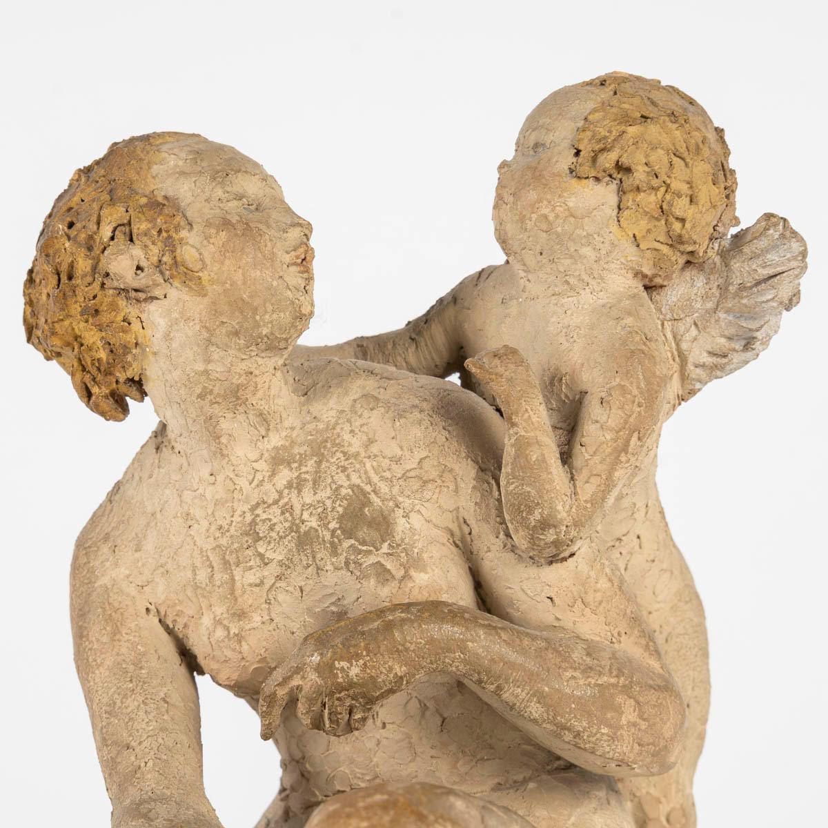 Terracotta sculpture by Arry Bitter, Love and Cupid.

Terracotta sculpture by Arry Bitter, Love and Cupid, original terracotta with polychrome remains.
H: 17cm, D: 14cm