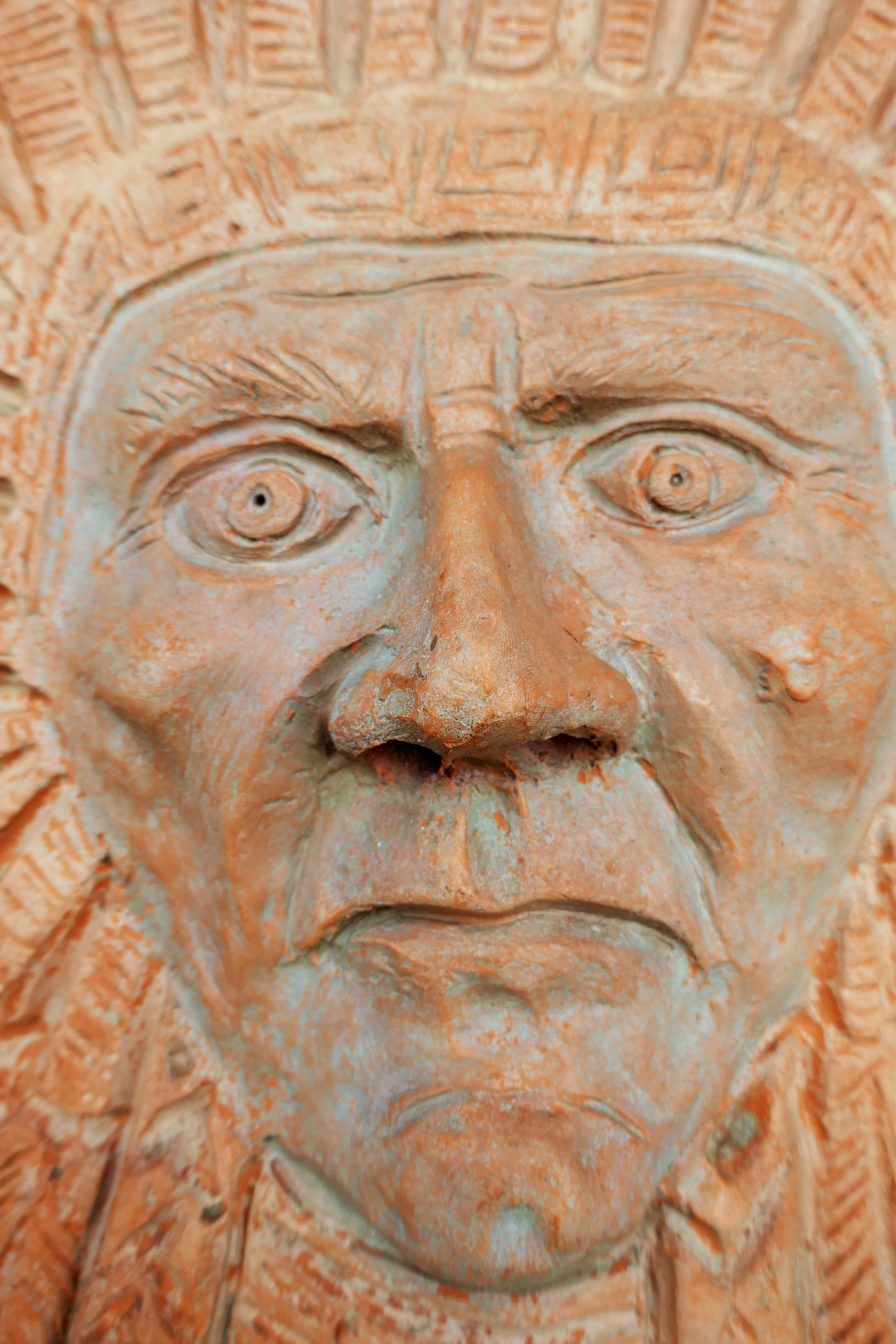 Italian Terracotta sculpture by Roberto Cossellu - Sitting Bull? Indian For Sale