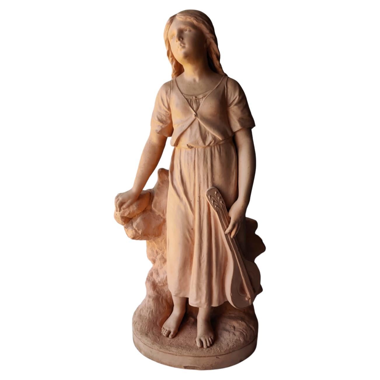Terracotta sculpture girl with a mandolin attributed to Vallmitjana For Sale