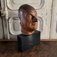Escultura de terracota - Máscara masculina sobre base de mármol negro de Charles Filleul, s. XX