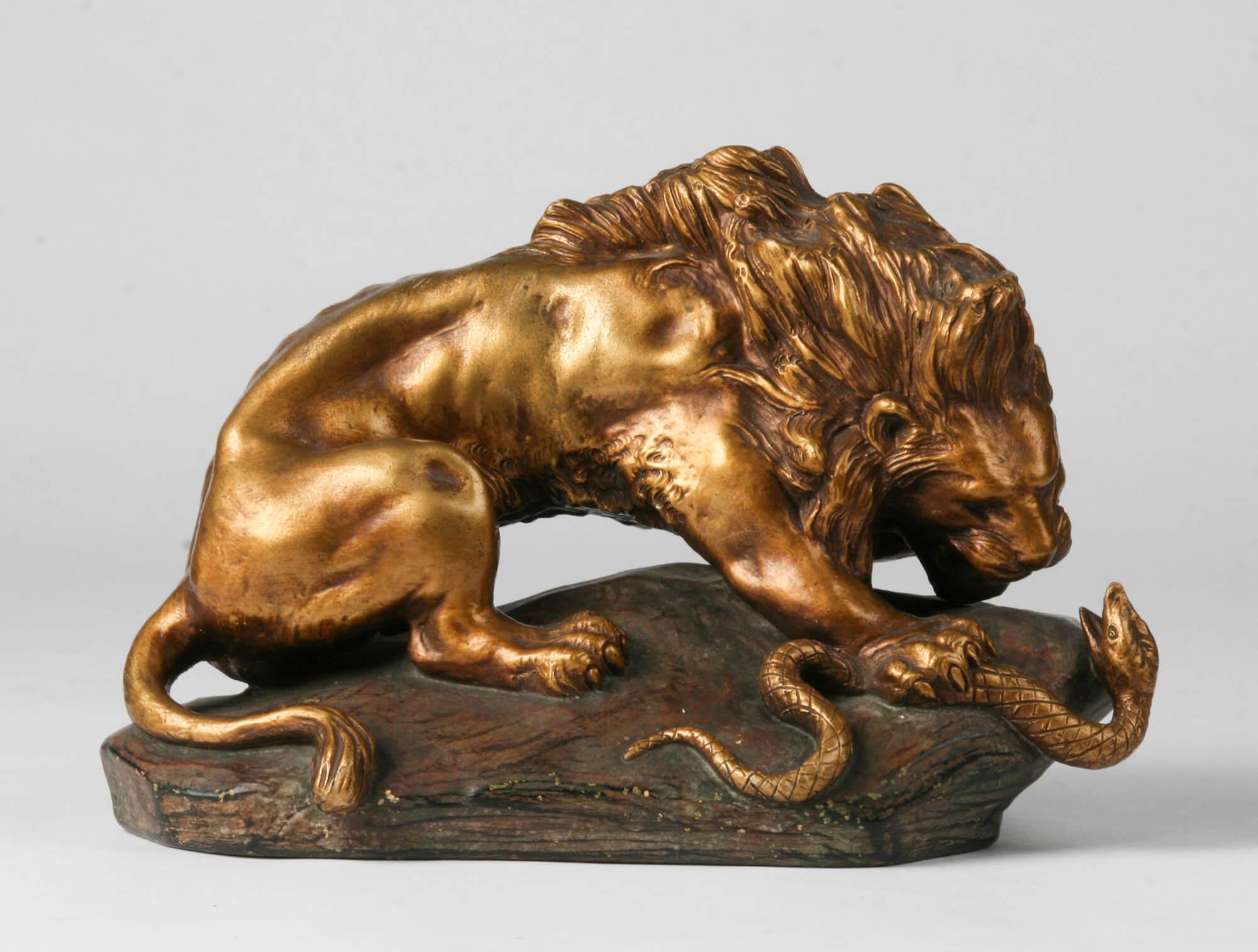 Powerful terracotta statue of a lion fighting a snake. The image is signed 'A. Fagotto'. This is an Italian sculptor who was very productive at the beginning of the 20th century.
The image is patinated in a bronze color.
