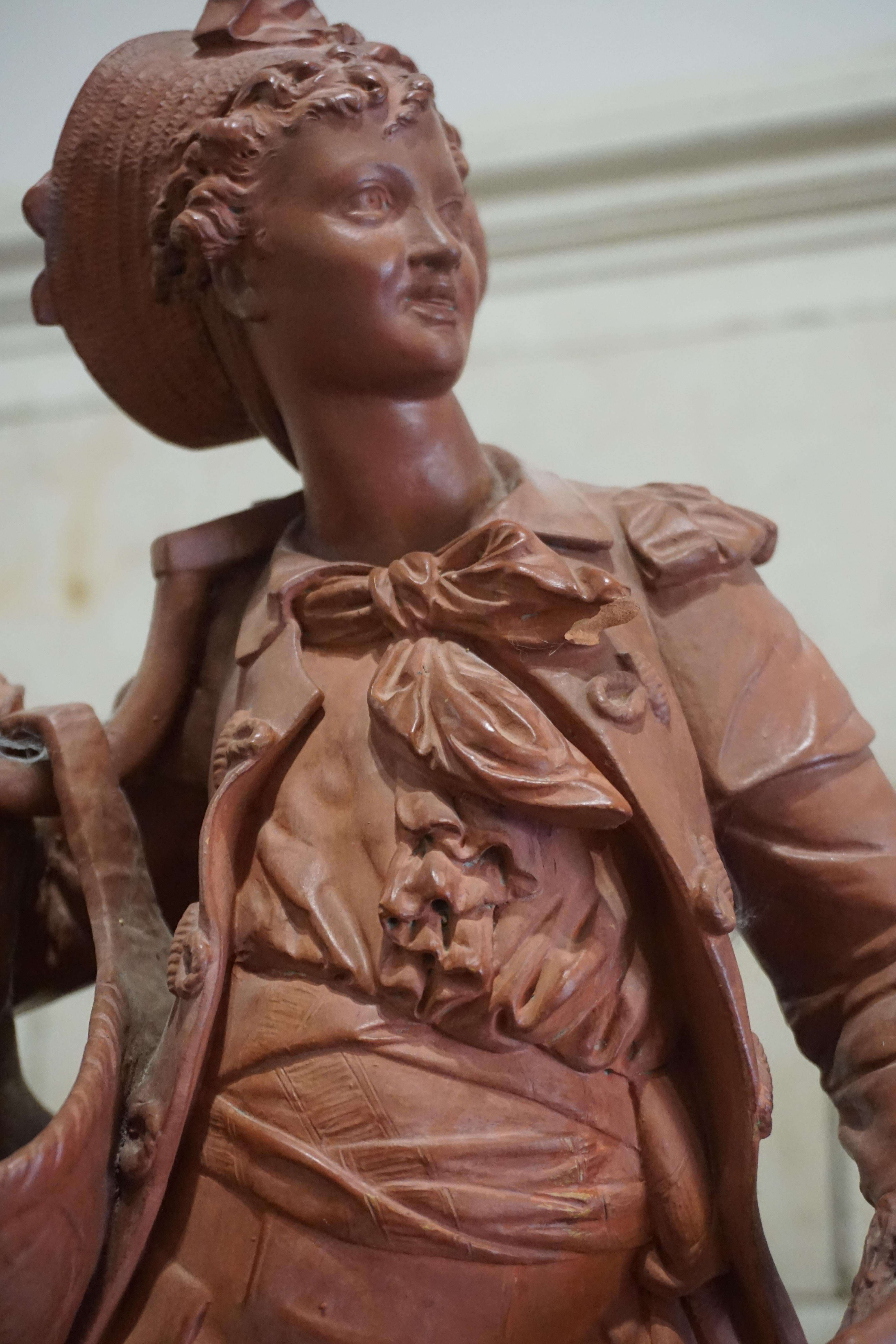 French terracotta statue of young boy.

Origin: France, circa 1880

Measurements:
11? W x 8? D x 25.5? H.