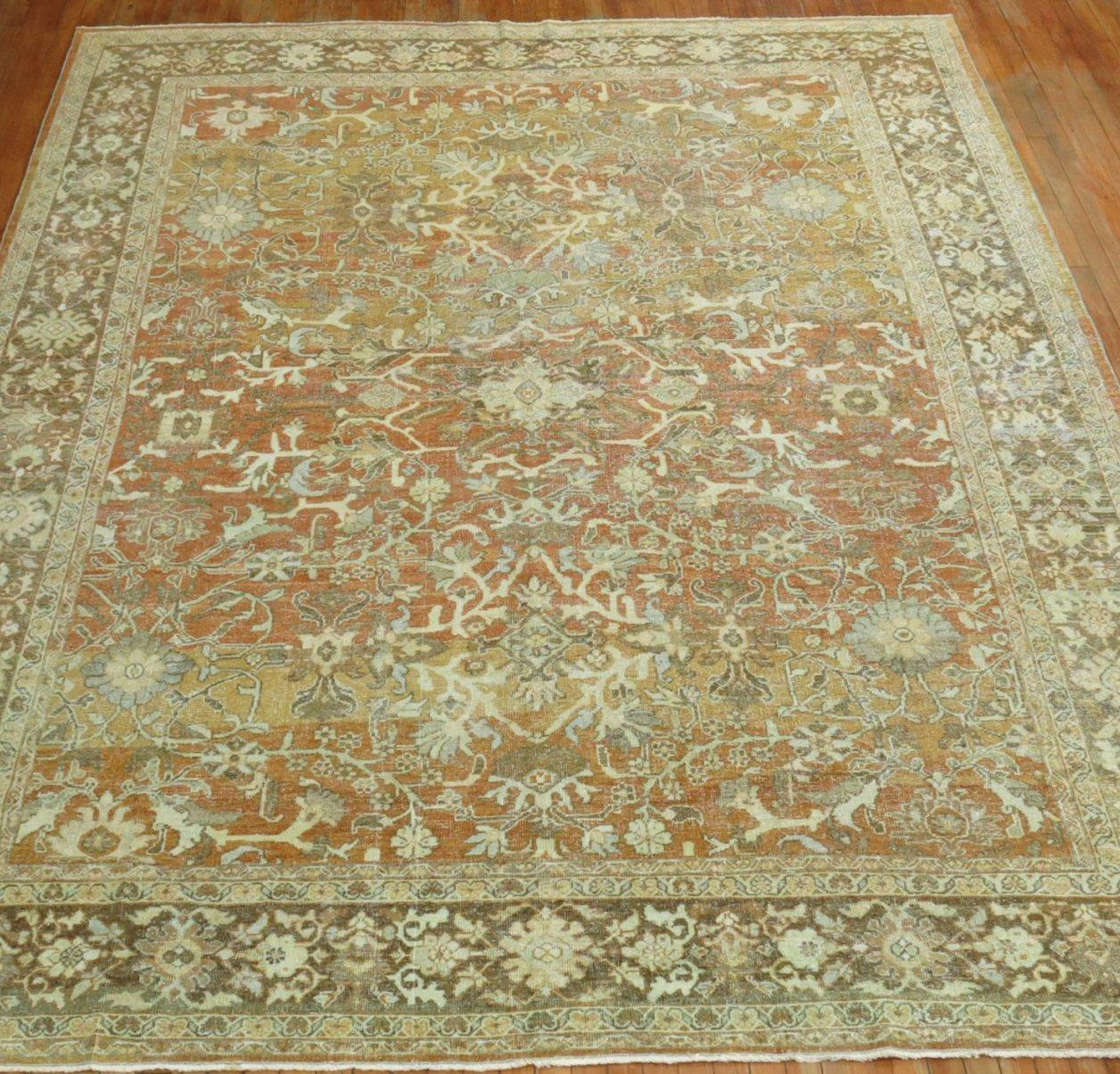 Room size early 20th century antique Persian Mahal rug with an all-over design in predominant terracotta's and brown accents. 

Measures: 9' x 12'1