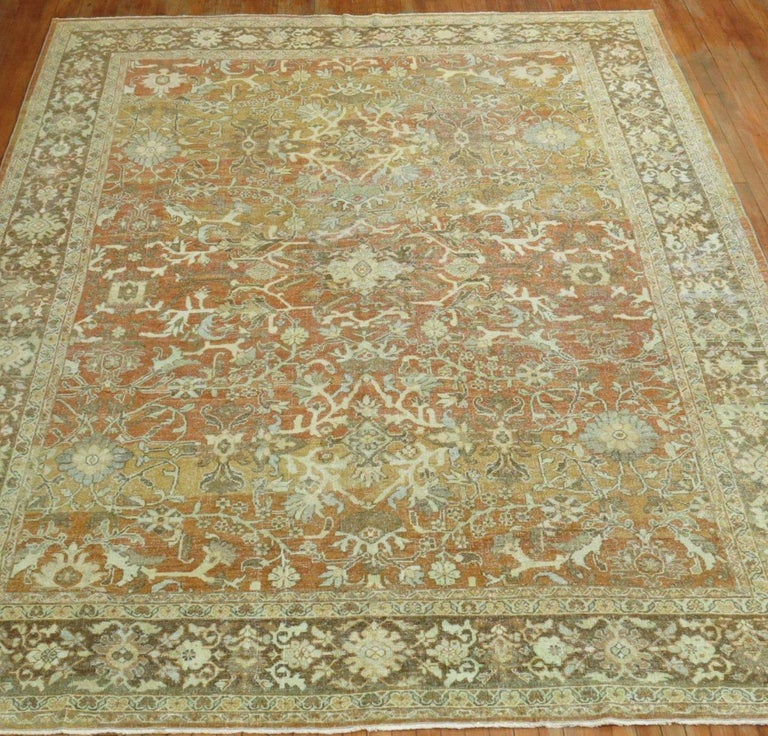 Room size early 20th century antique Persian Mahal rug with an all-over design in predominant terracotta's and brown accents. 

Measures: 9' x 12'1