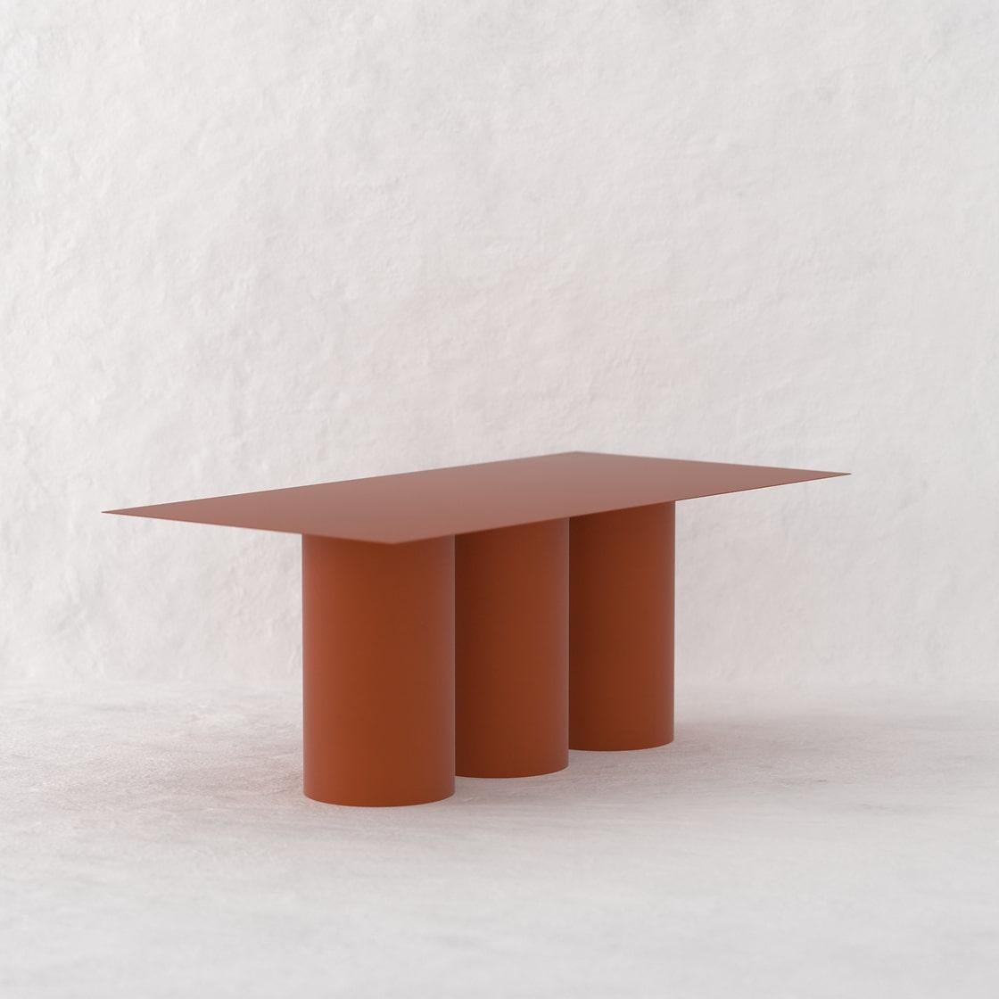 The Tripod Dining Table is a monolithic piece conceptualized as a dining table suitable for both, indoor and outdoor. 
Crafted by hand in metal and coated with a matte electrostatic finish it's size can be customized.
The Tripod Dining Table seats 8