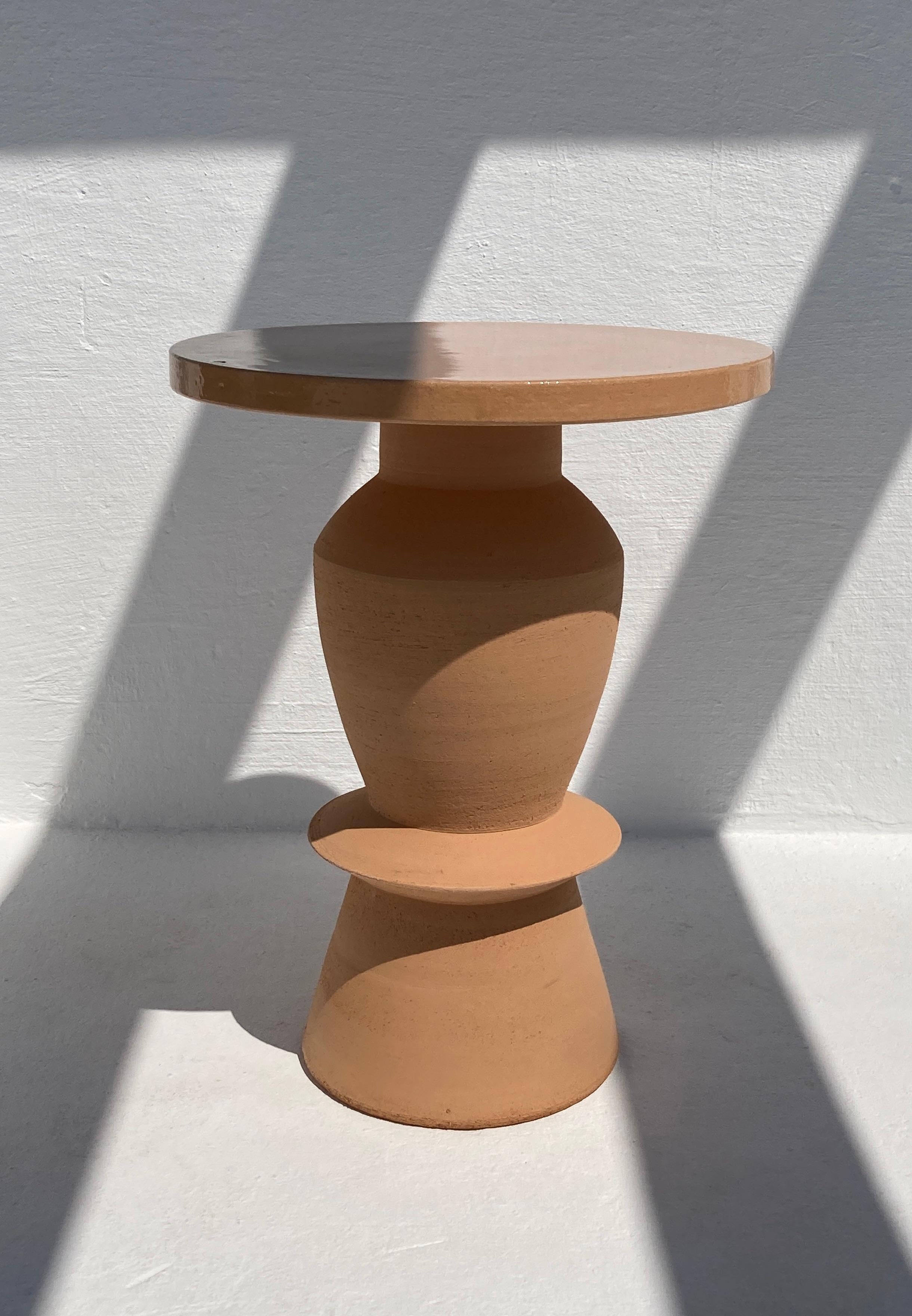 Terracotta union side table by Lea Ginac
Unique Piece. 
Dimensions: Diameter 40 x Height 47 cm 
Materials: Terracotta Chamotte Clay. Handmade Ceramic. 
Technique: Hand-modeling.
Available in three other designs. Also available in White.