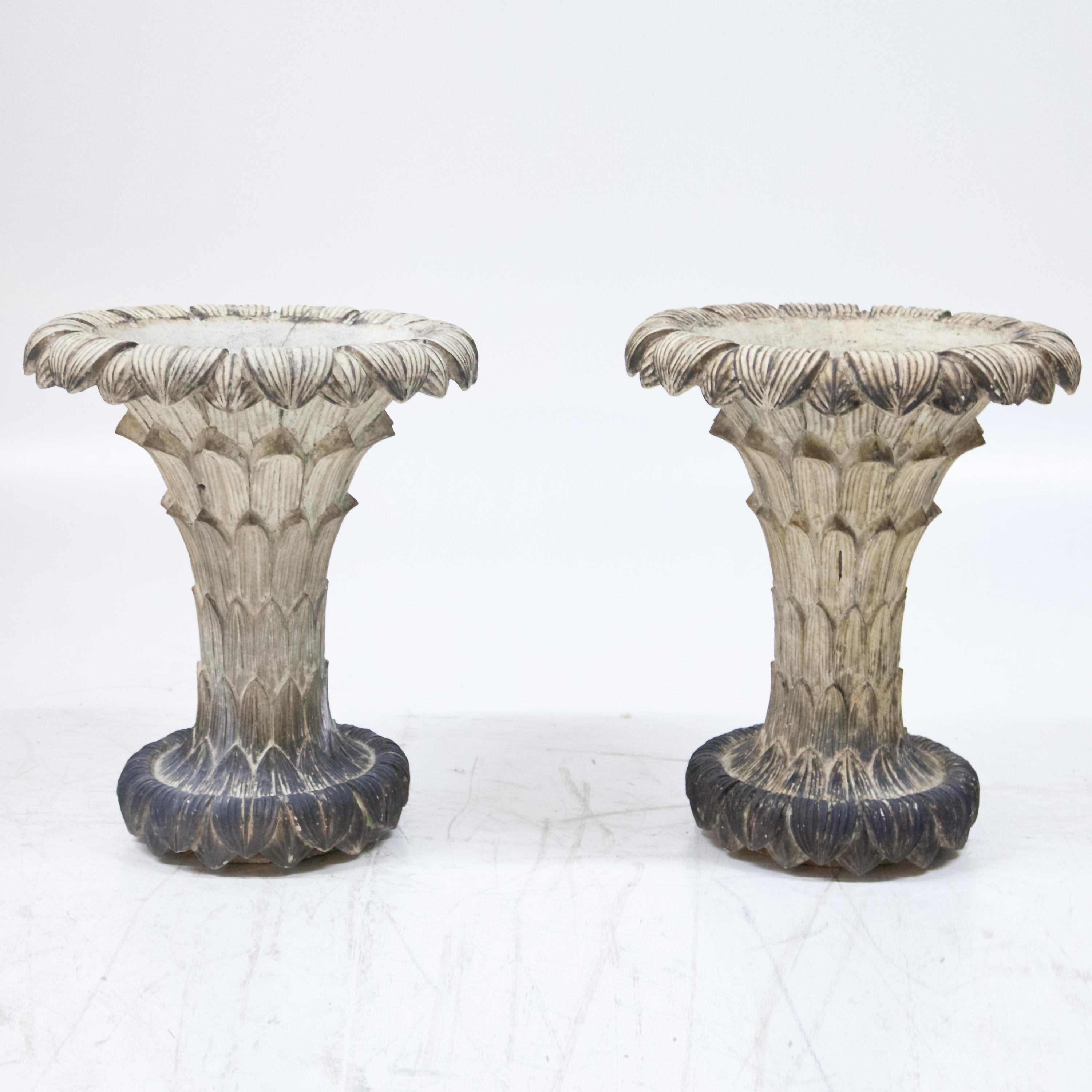 Pair of vases in the form of terracotta leaf cups, patinated in white.
    