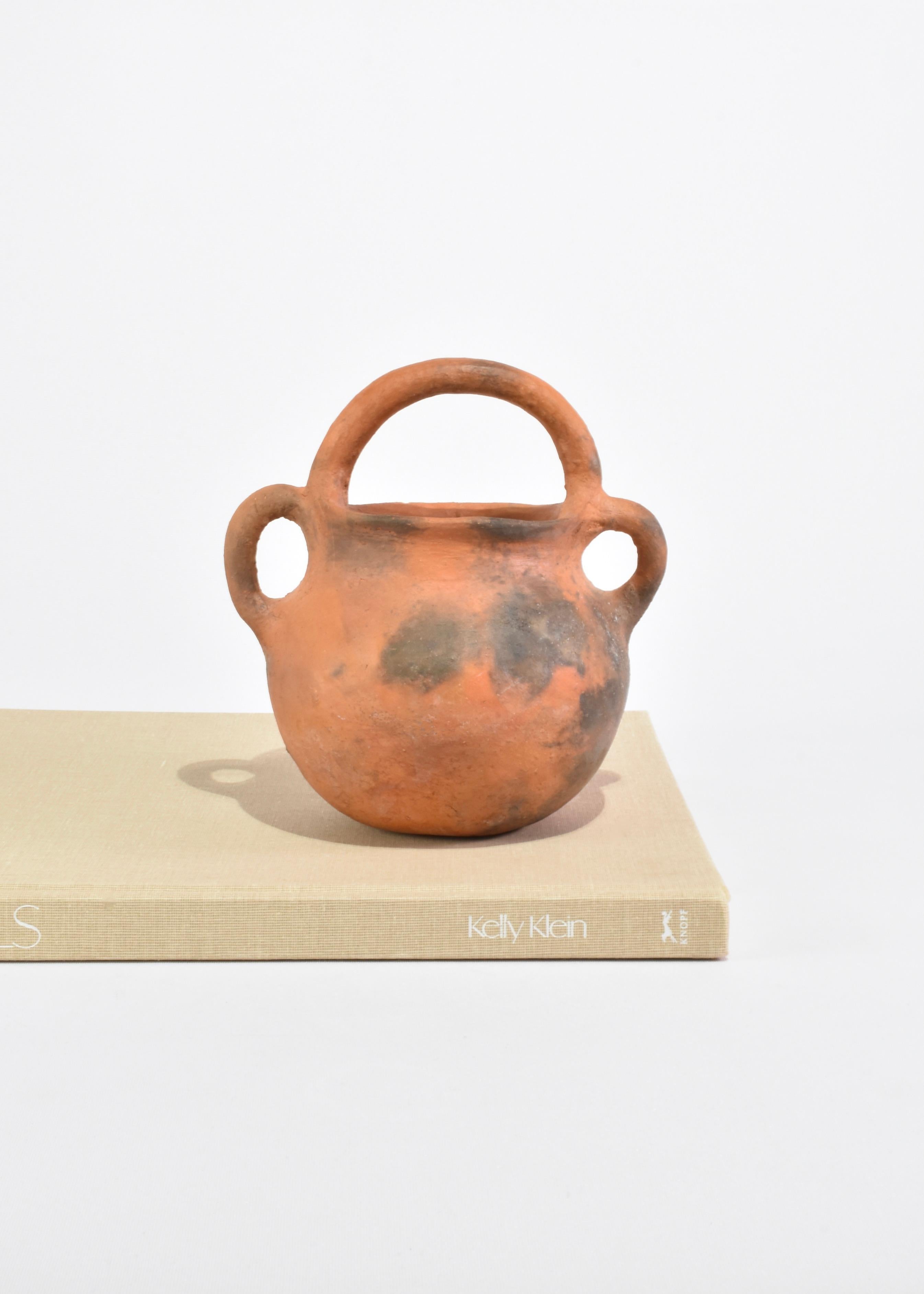 Vintage handmade terracotta ceramic vessel with three handles