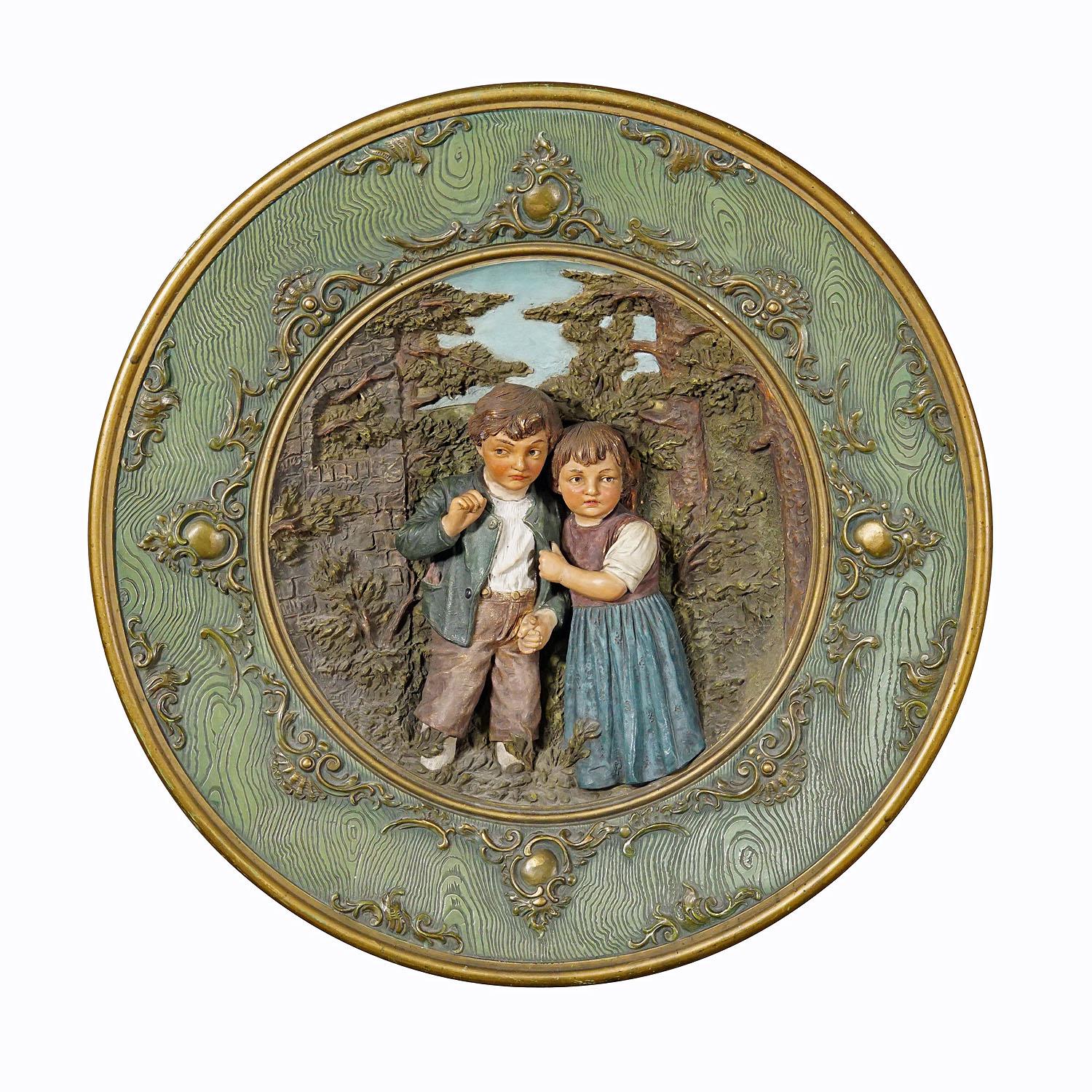 Terracotta Wall Plate with Whimsy Children in Farmer Costumes by Johann Maresch

A large terracotta wall plate depicting a relief couple of farmers childs in a forest enviroment. Manufactured by Johann Maresch, Aussig Austria in the late 19th