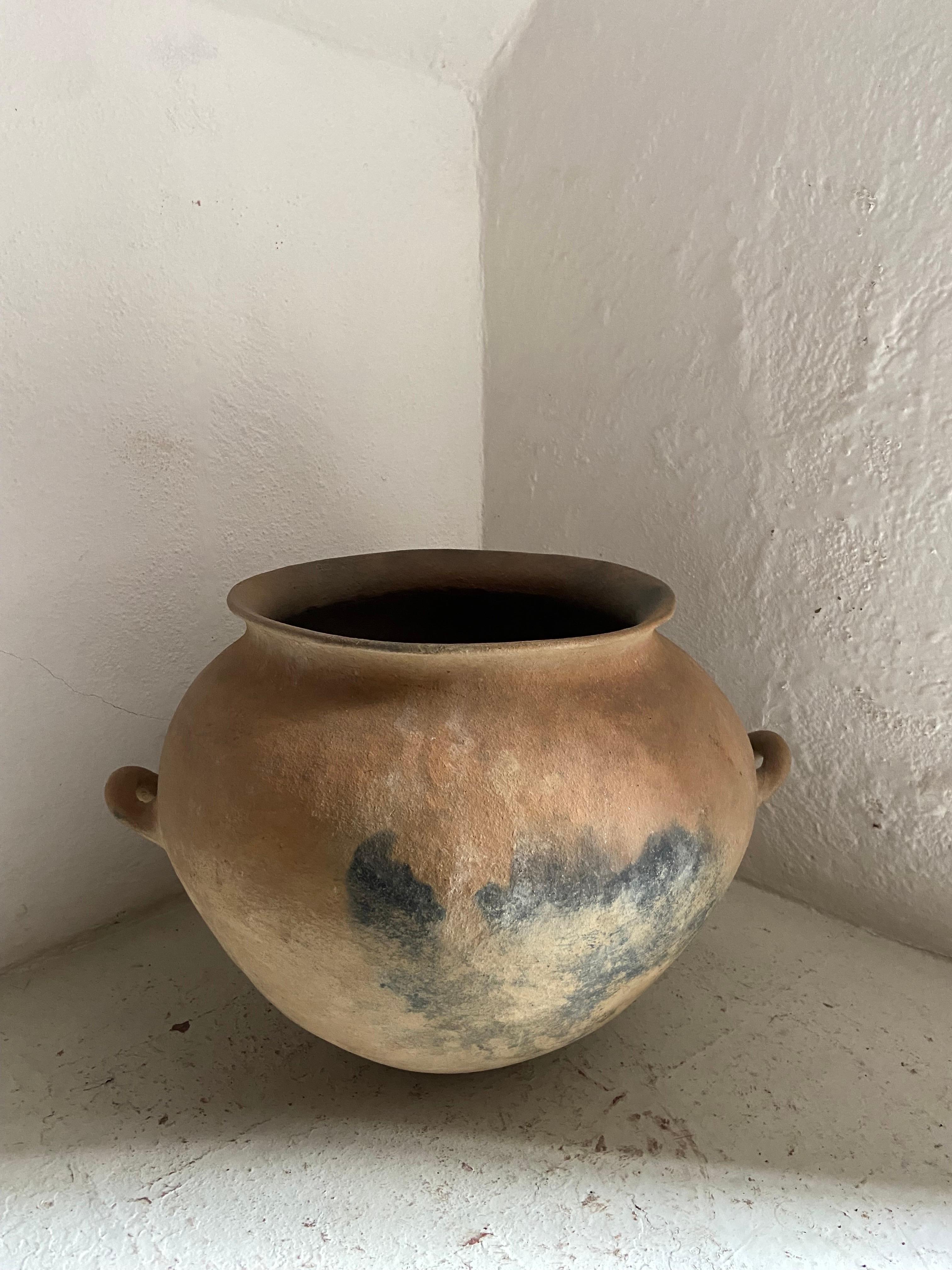 Terracotta water pot from the high sierras of Puebla, Mexico, circa 1970´s. The vessel was hand crafted in the 1960´s - 1970´s and has a beautiful form. Handles are original and completely intact.