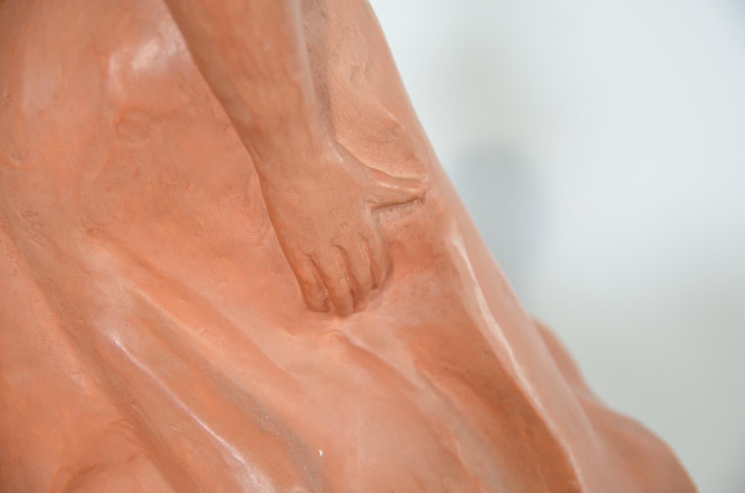 Art Deco terracotta sculpture of a young excited lady, revolving in her elegant summer dress. The sculpture is signed by the Belgian artist, P. Sersté.