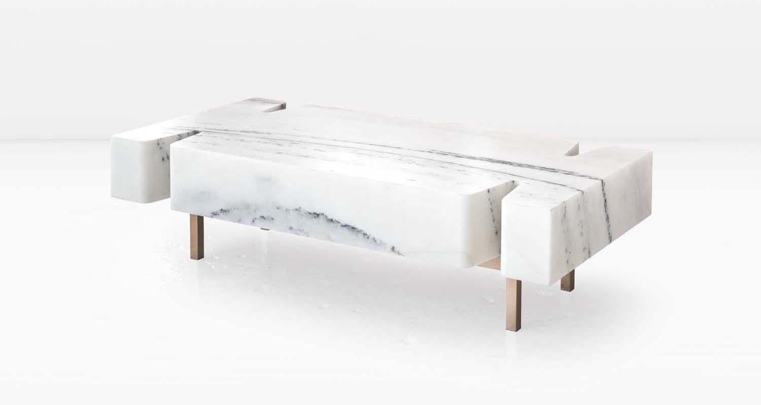 The Terranova Coffee Table is a simple concept: a solid, rectangular block of marble which has been interrupted to accept the metal prong legs which delicately support it. 

Shown with a Statuary Marble top and Solid Silicon Bronze base. 

The