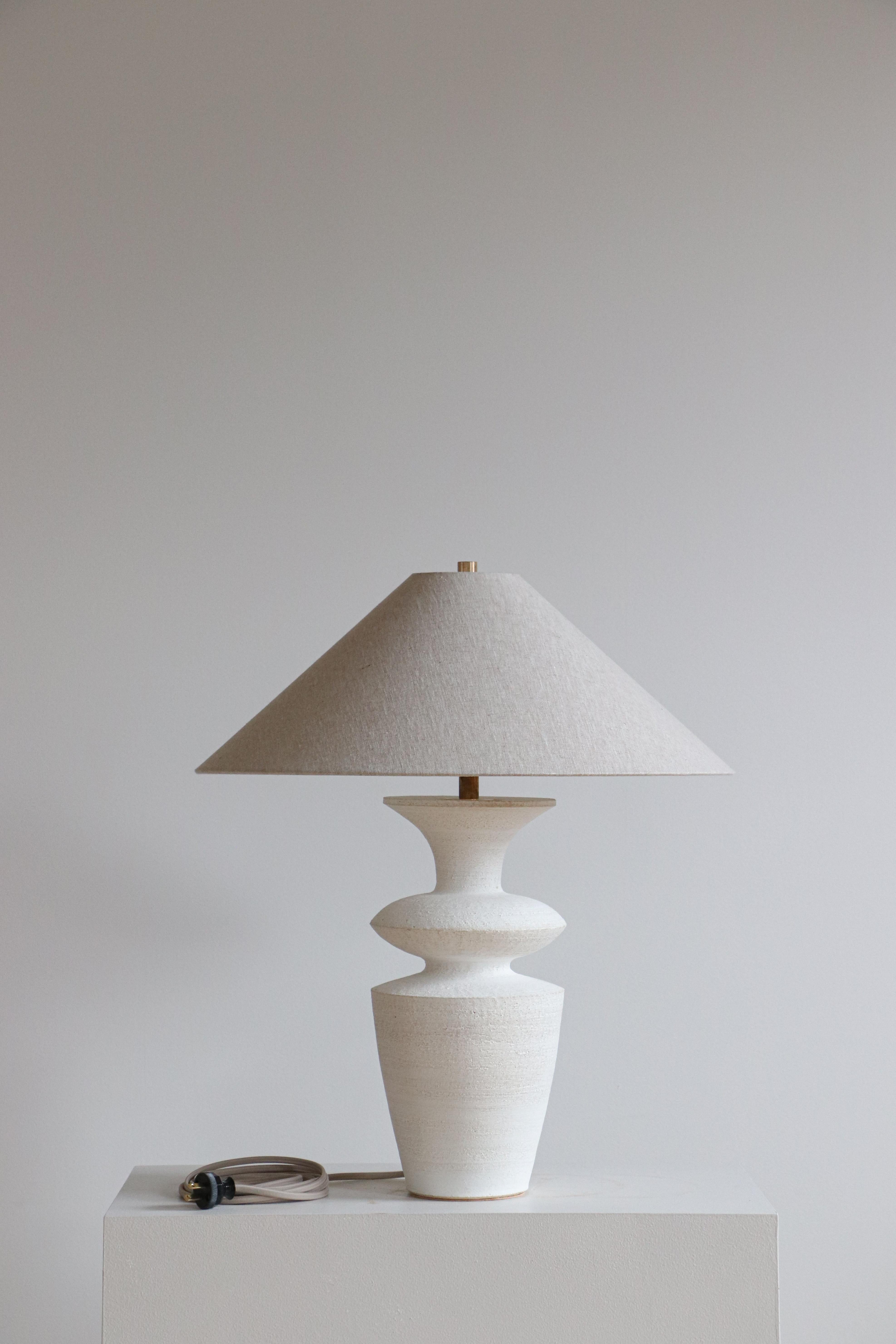 Terrasig Rhodes Table Lamp by Danny Kaplan Studio
Dimensions: ⌀ 51 x H 69 cm
Materials: Glazed Ceramic, Unfinished Brass, Linen

This item is handmade, and may exhibit variability within the same piece. We do our best to maintain a consistent