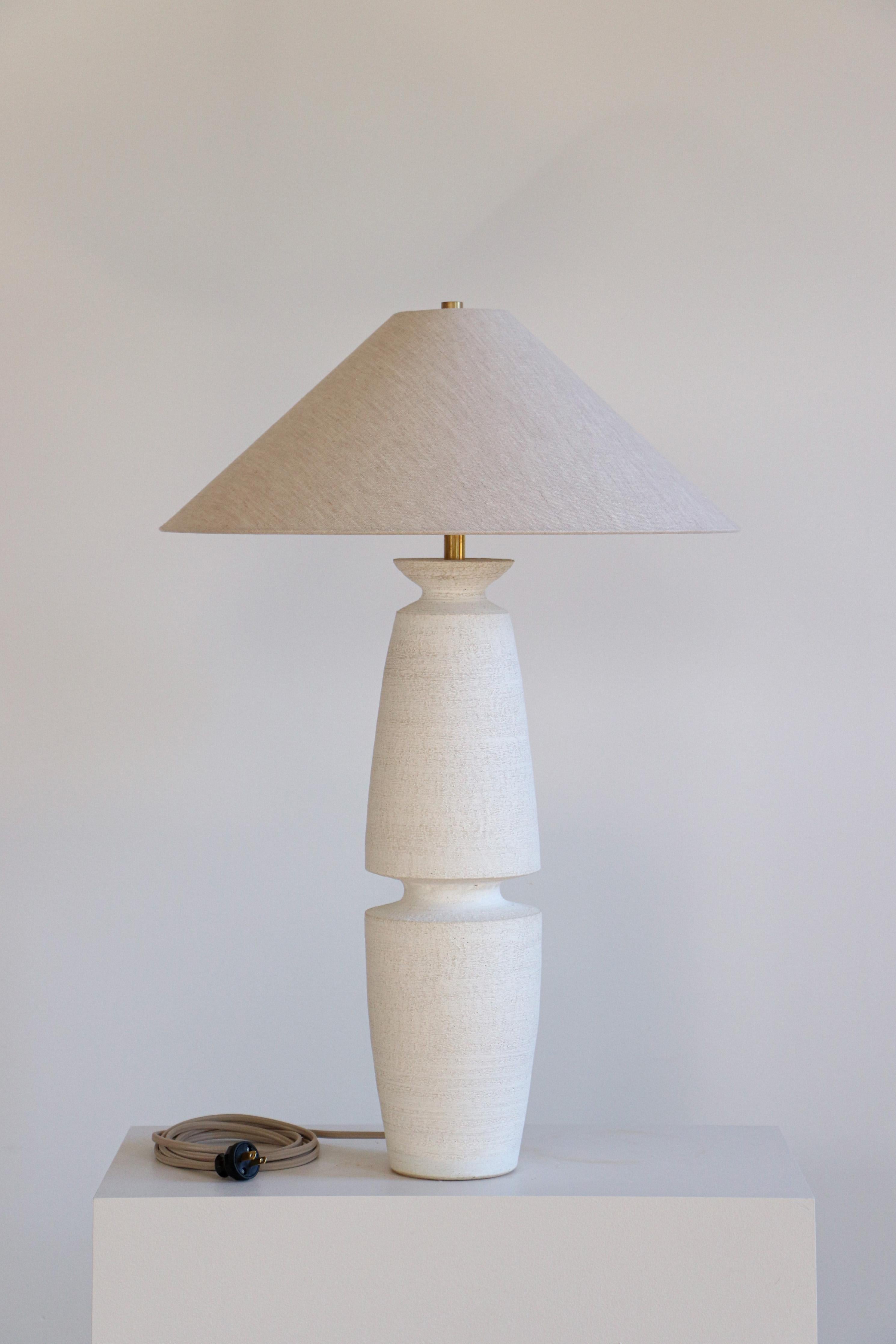 Terrasig Serena Table Lamp by Danny Kaplan Studio
Dimensions: ⌀ 51 x H 71 cm
Materials: Glazed Ceramic, Unfinished Brass, Linen

This item is handmade, and may exhibit variability within the same piece. We do our best to maintain a consistent