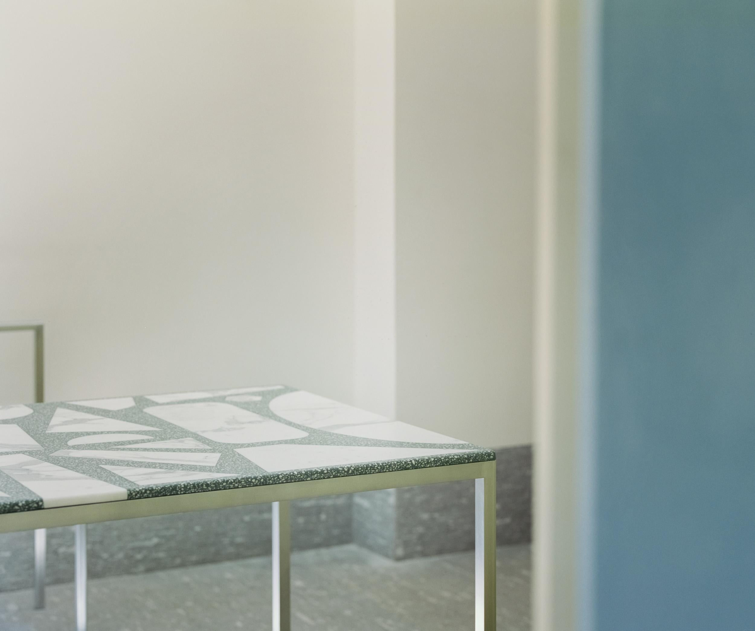 Terrazzo dining table by Stefan Scholten.
Dimensions: L 240 x W 90 x H 73 cm.
Materials: Aluminium, Statuario.

Stefan Scholten is a Dutch designer born in 1972. After graduating from the Design Academy Eindhoven he set up Copray & Scholten