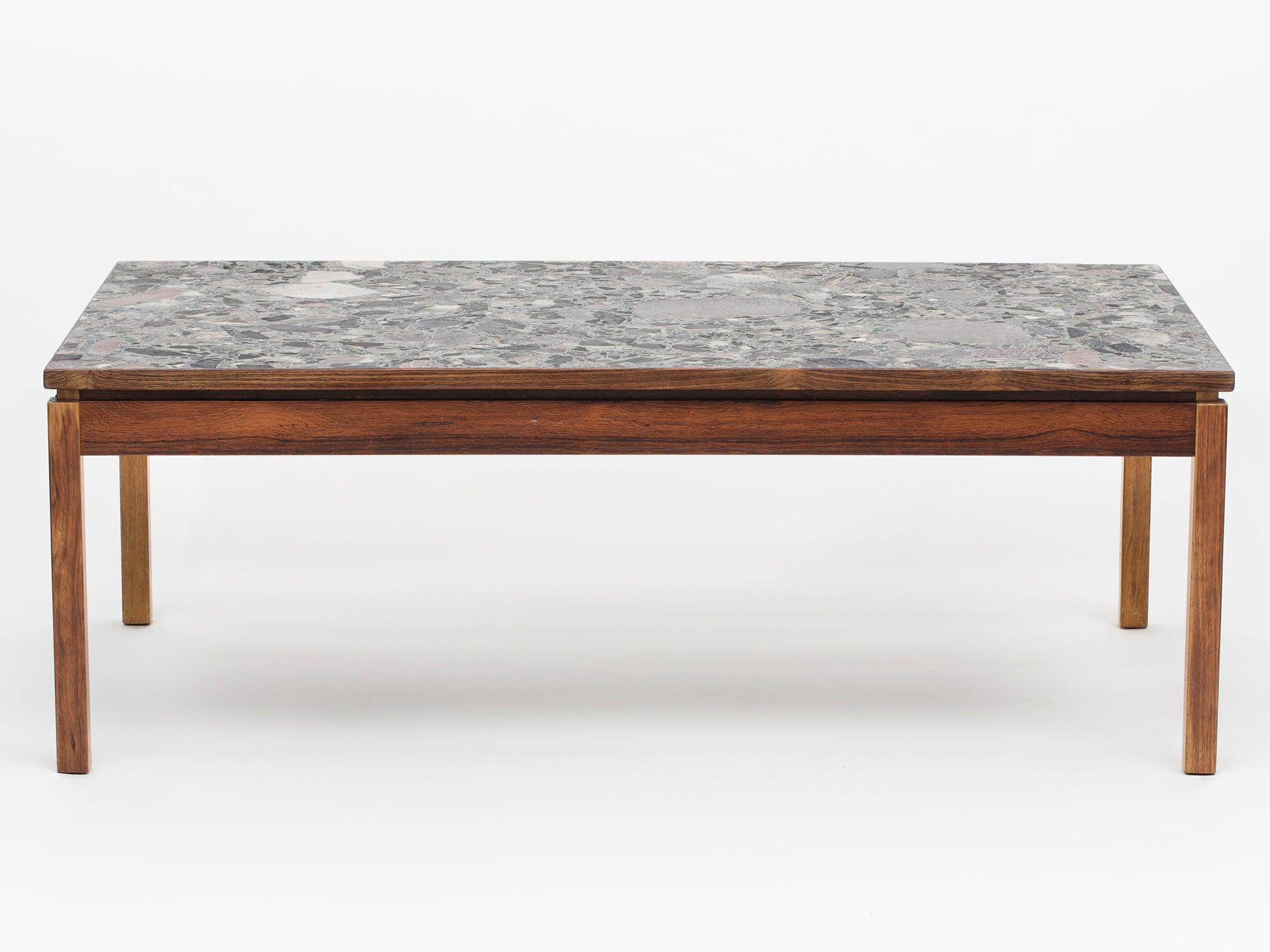 Erling Viksjø was a Norwegian architect and designer best known for his Brutalist architecture and furniture using concrete and stones. This unique terrazzo coffee table from the 1960s is made of concrete, Norwegian stones, and rosewood.


  
