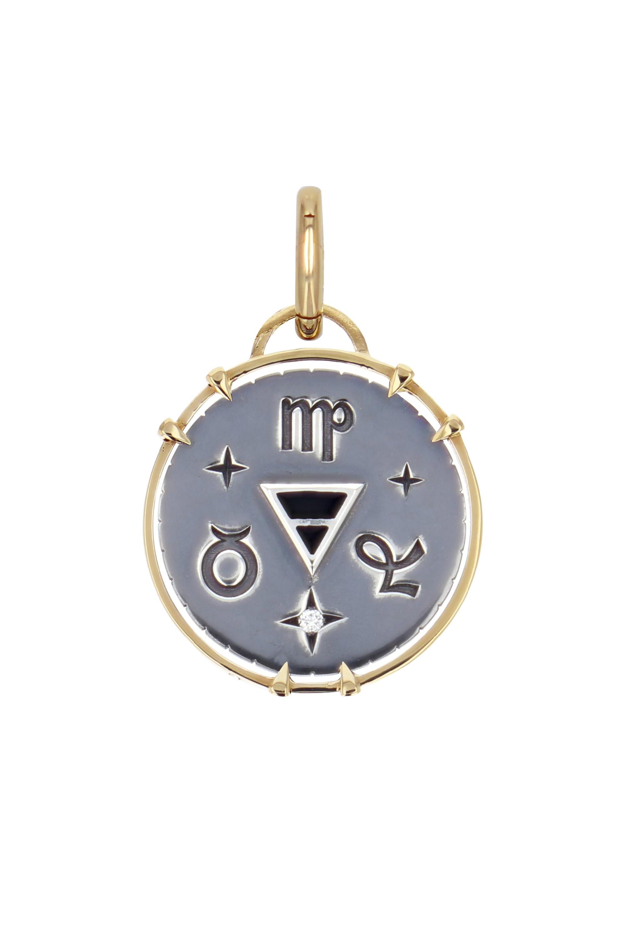 Yellow gold and distressed silver charm. Studded with a diamond, the charm embraces all the symbols linked to the Earth sign with a gold tile on its front and the alchemy triangle surrounded by its zodiac signs (Virgo, Capricorn, Taurus) on its