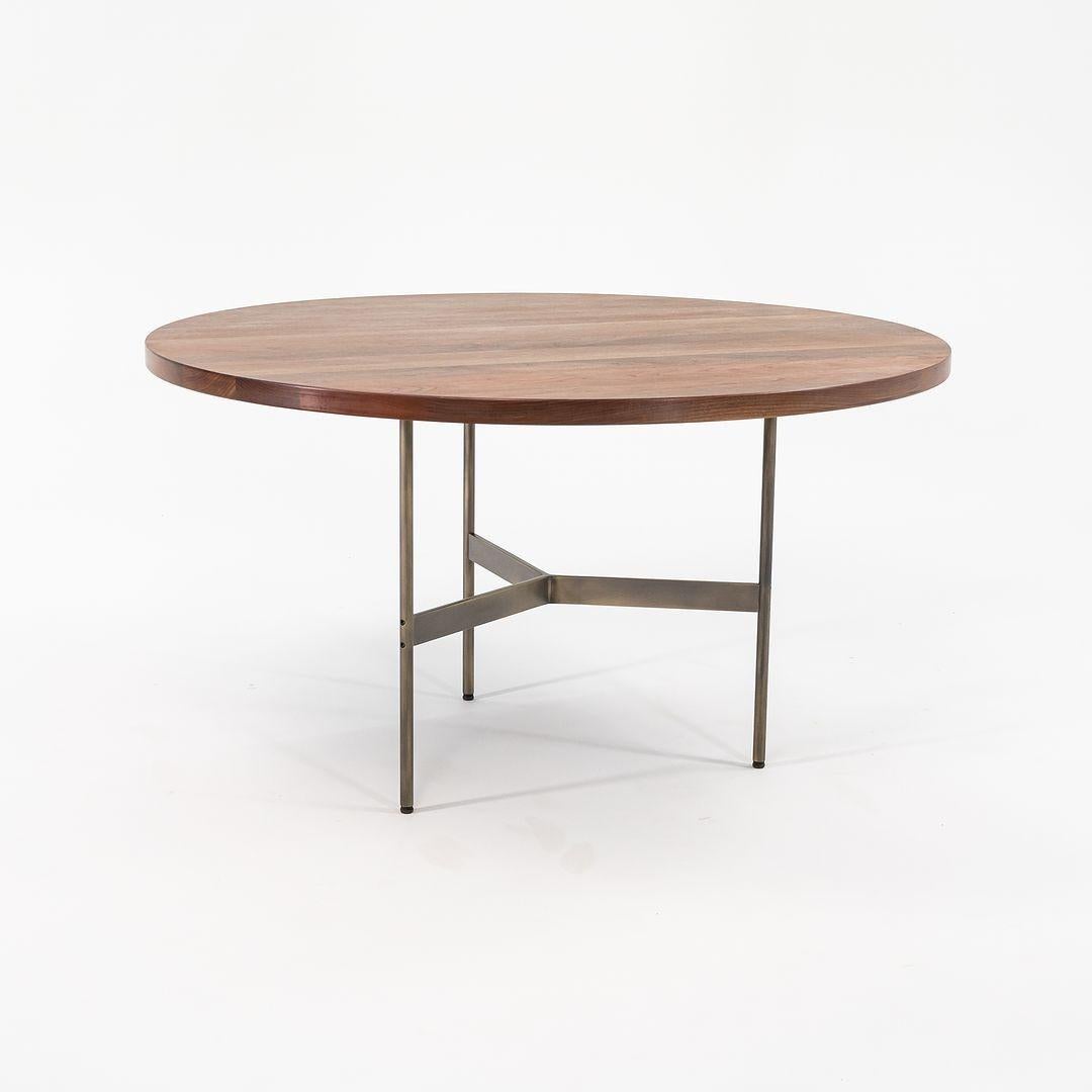 This is a Terrenia round dining table, produced by Gratz Industries. Its fabrication is detailed exactly as you would expect from a Laverne piece, however, we are uncertain as to whether it was an original Laverne design. The top is constructed from