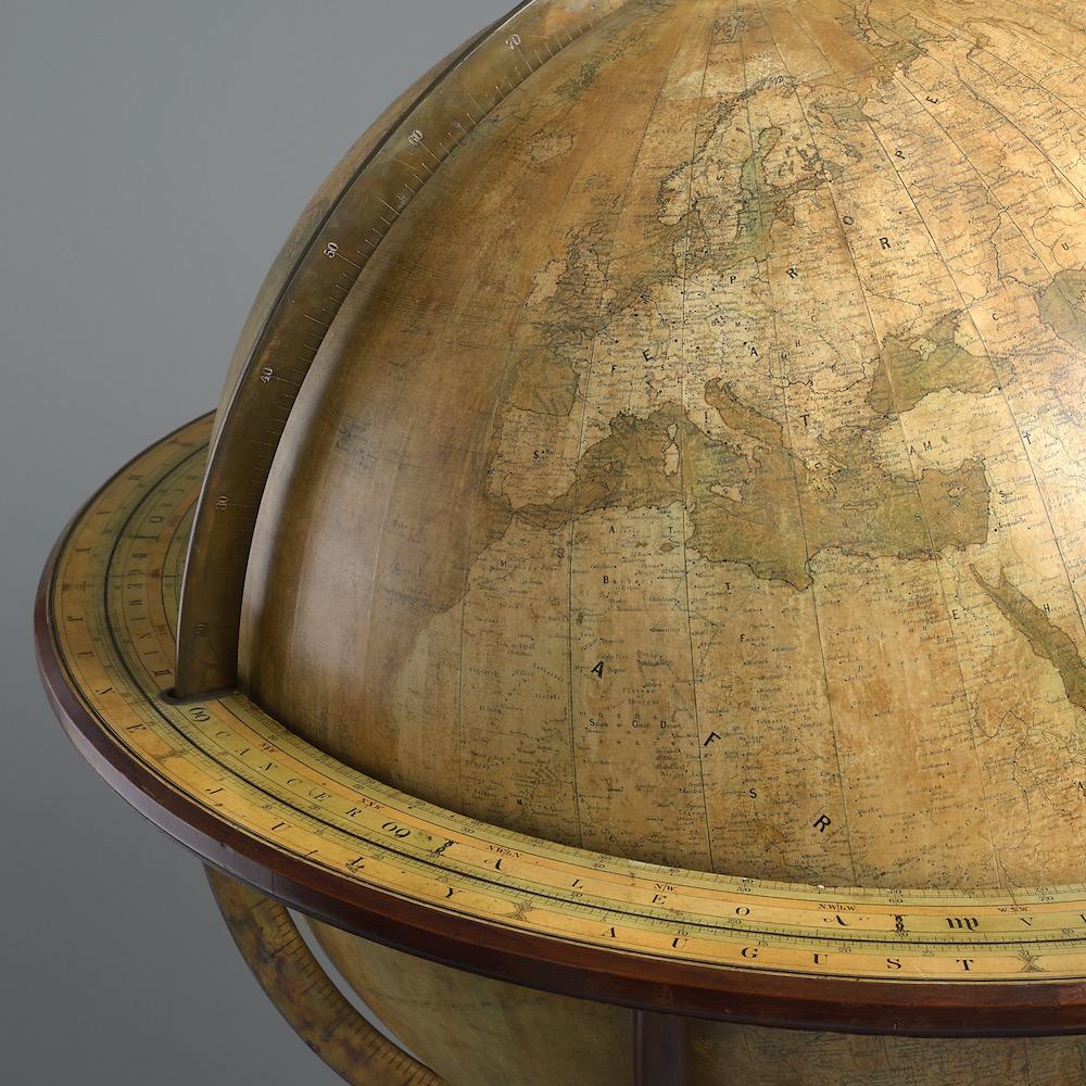 A late Victorian mahogany 30 inch terrestrial globe by Johnston, circa 1890.

The globe inscribed 30 INCH TERRESTRIAL GLOBE BY W & A K JOHNSTON LIMITED, Geographers, Engravers & Printers Edinburgh & London. 
The stand with four legs carved with
